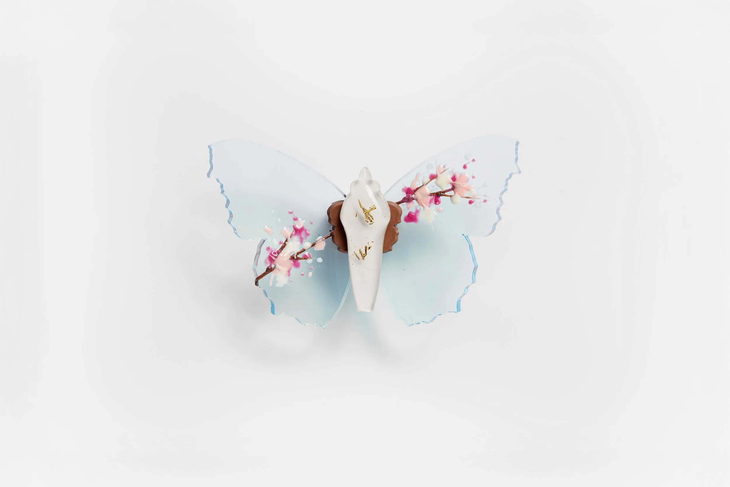 Miniature blue soft resin butterfly art featuring cherry blossoms representing the community affected by the Washington, D.C. mass shooting