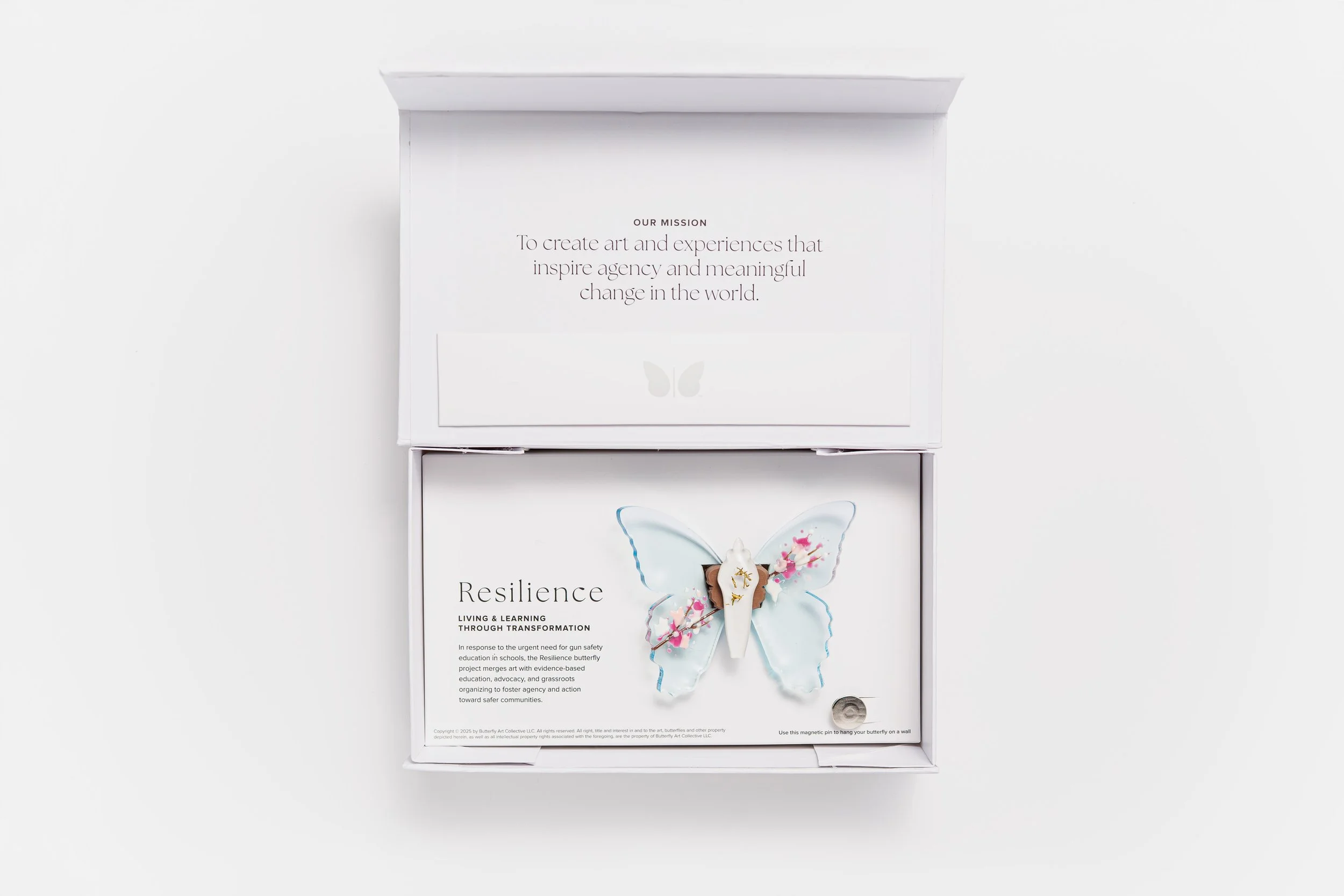 Miniature blue soft resin butterfly art featuring cherry blossoms representing the community affected by the Washington, D.C. mass shooting