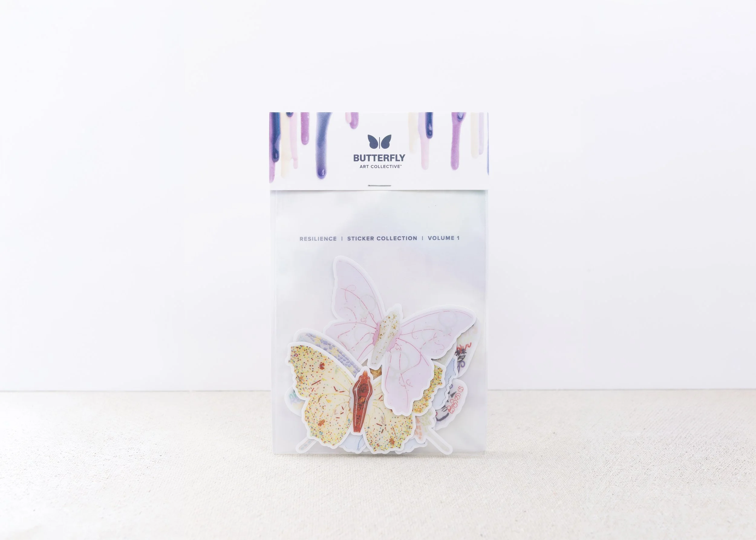 Resilience butterfly sticker collection by Butterfly Art Collective featuring colorful vinyl butterfly stickers in artist-designed packaging.