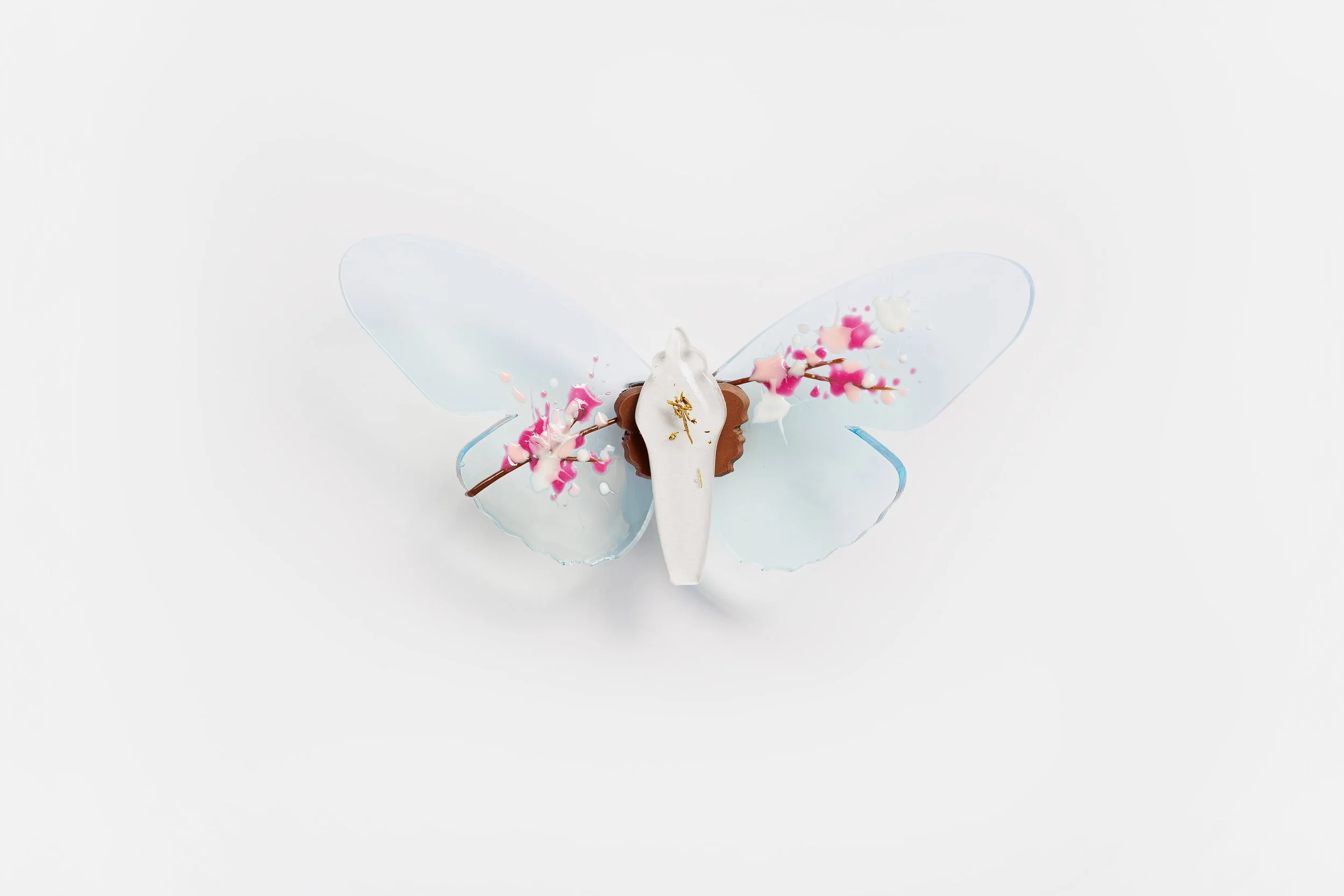 Miniature blue soft resin butterfly art featuring cherry blossoms representing the community affected by the Washington, D.C. mass shooting