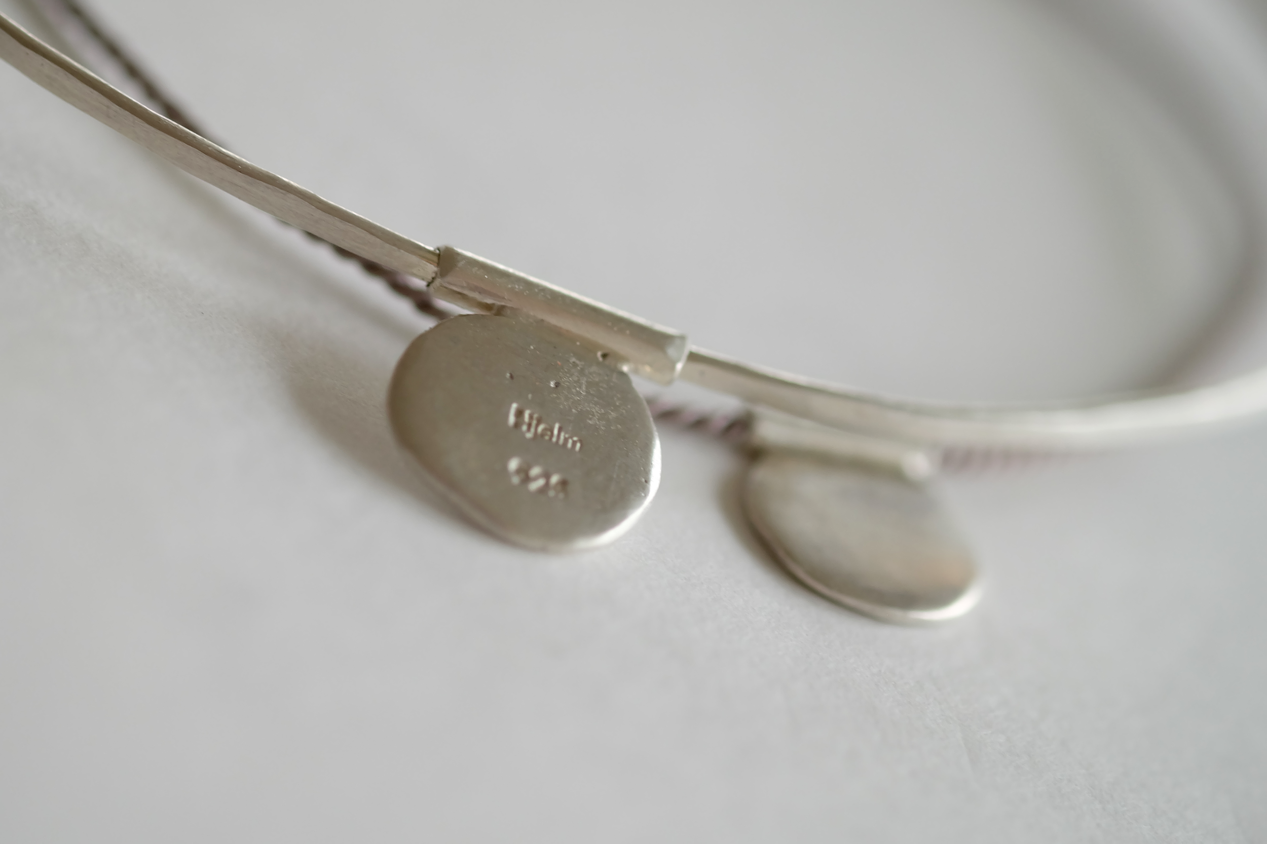Trail of Elephants_braceletx2_disc_wire_silk_closeup.png