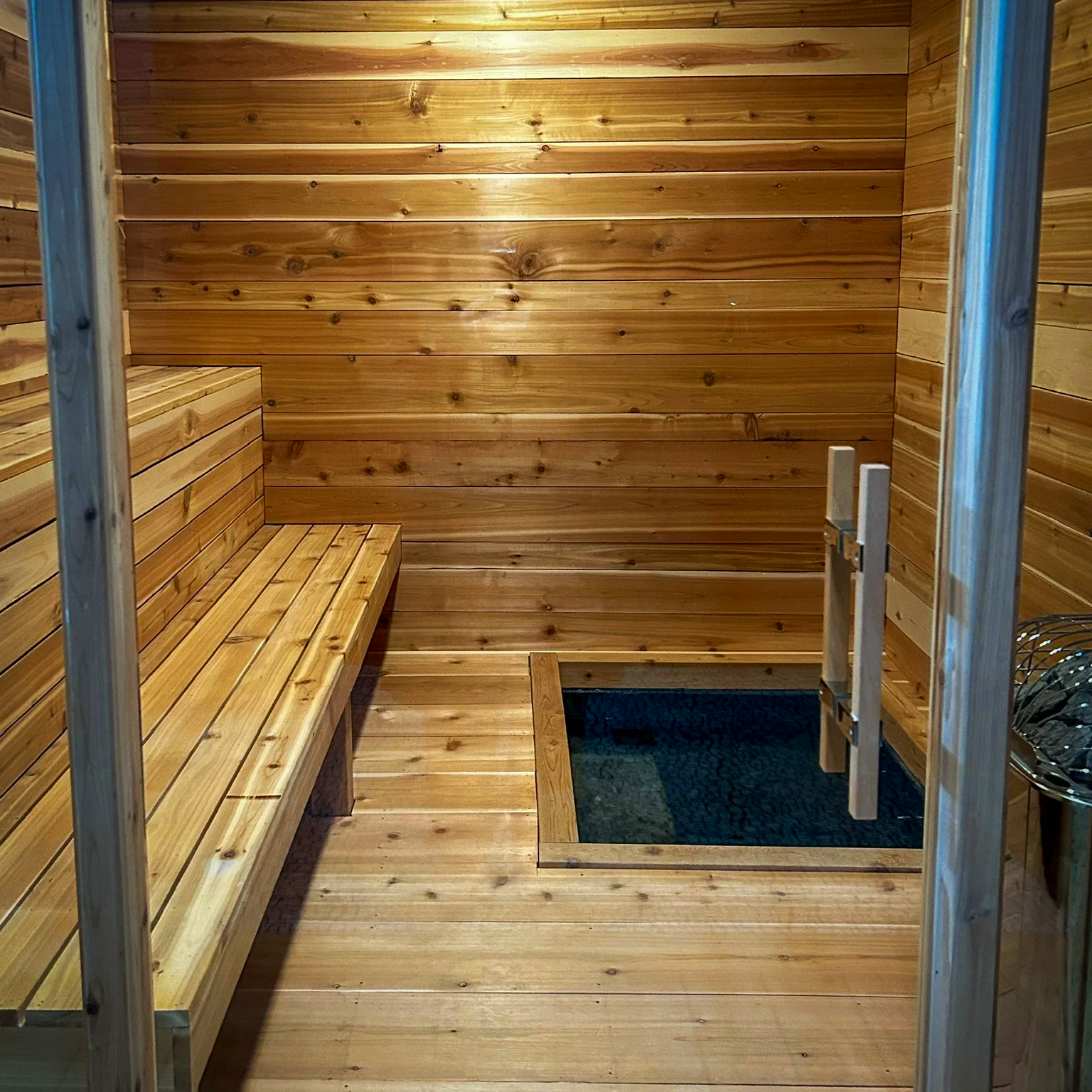Cedar ice sauna interior with built-in cold plunge basin at Nordic on Nine in New Windsor NY