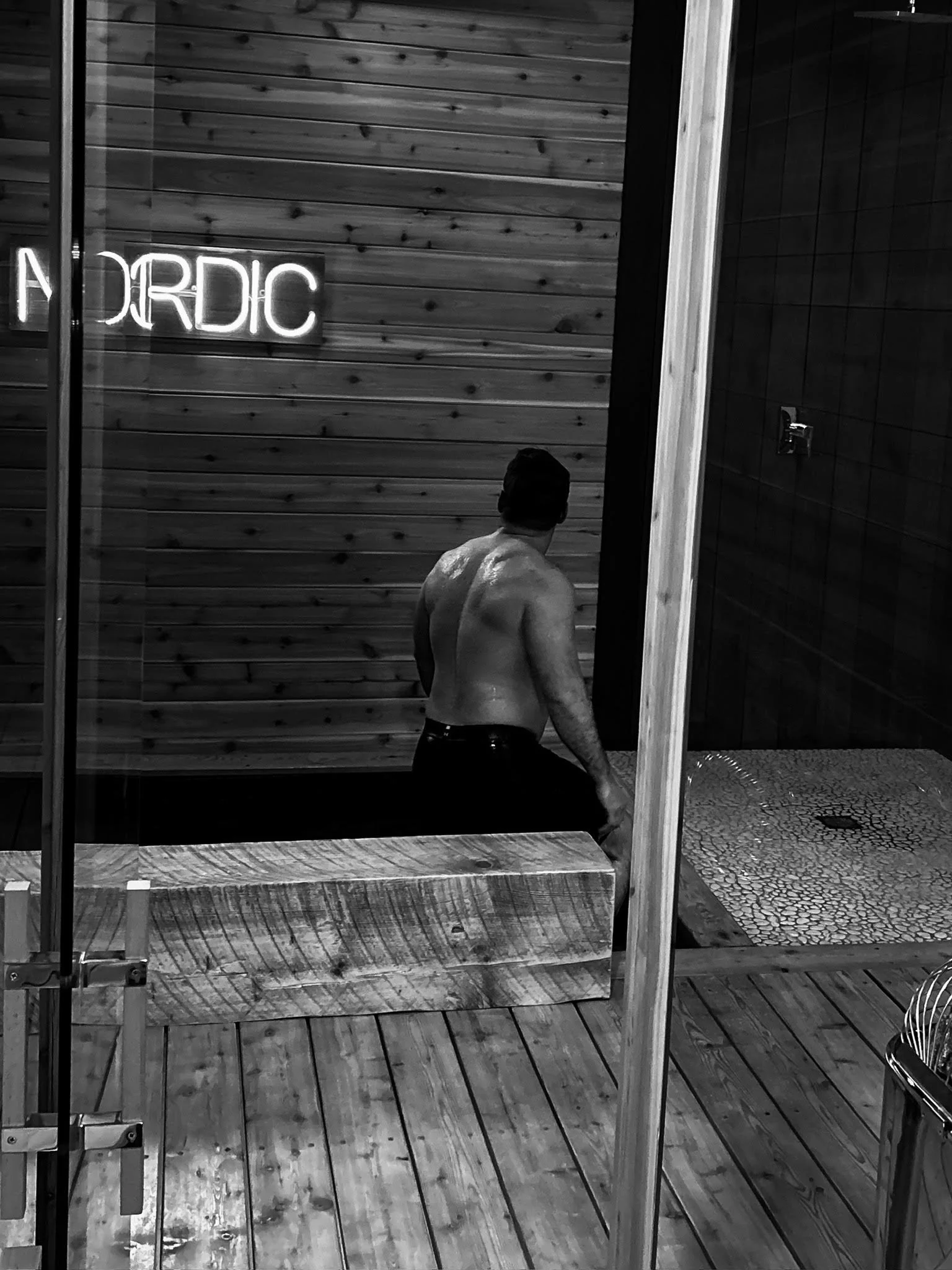 Man entering the sauna at Nordic on Nine Scandinavian wellness spa in Hudson Valley NY