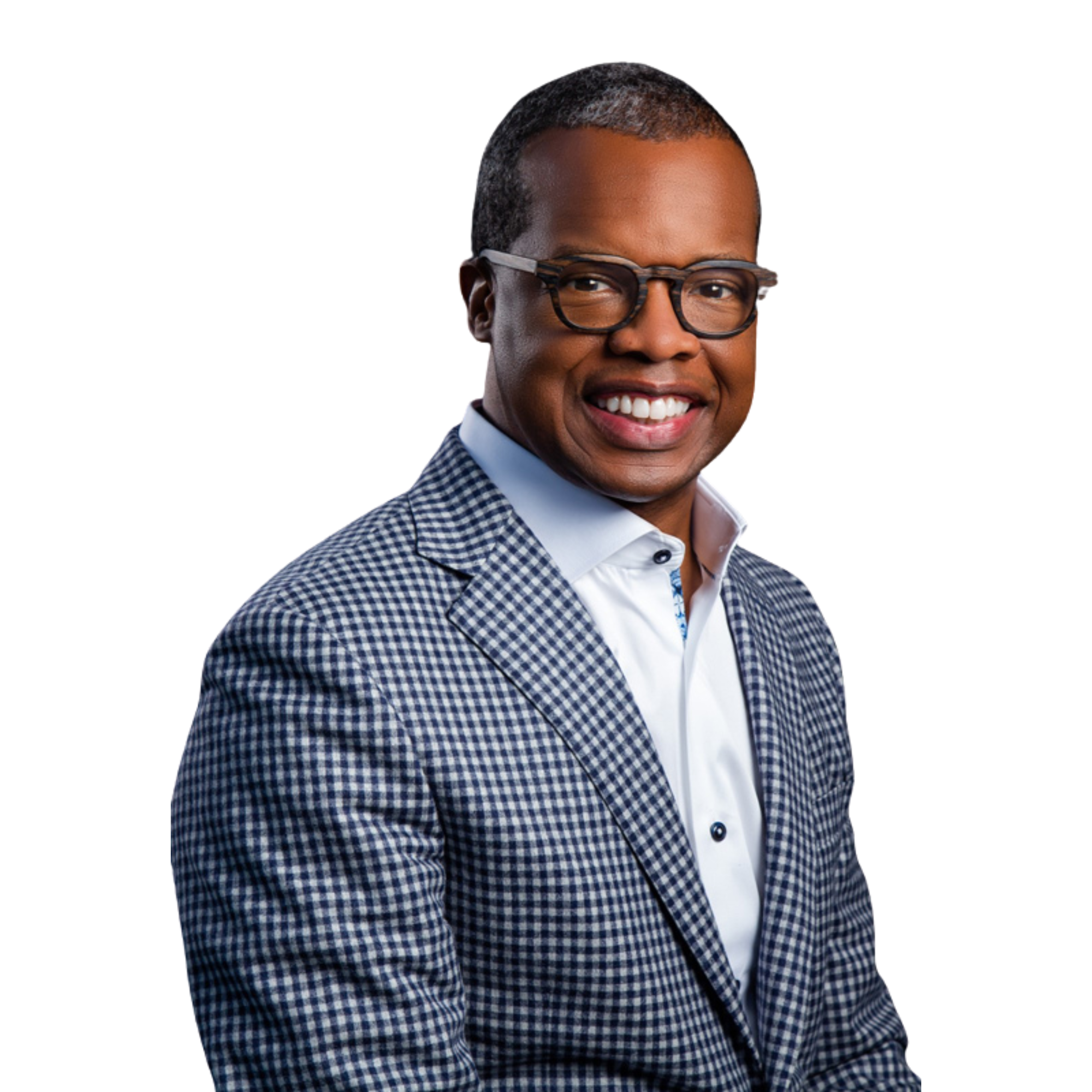 Smiling person wearing glasses and a checkered blazer