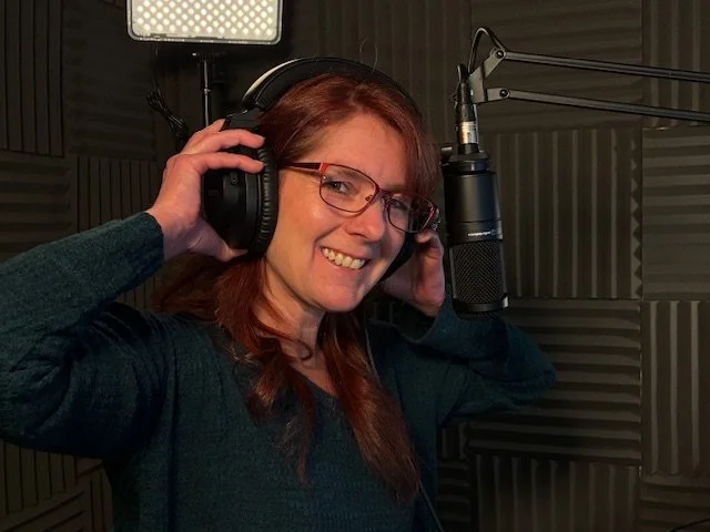female voice over artist with headphones