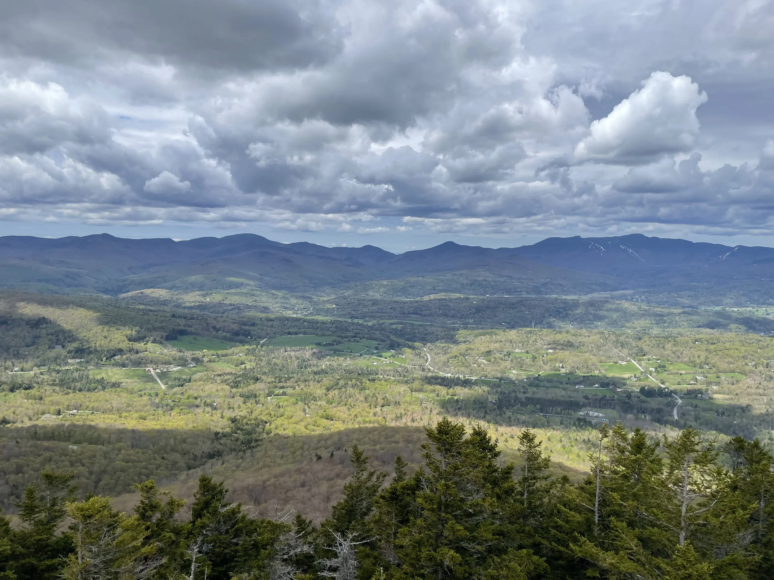 Mountain range with cloudy sky in Stowe, Vermont, taken by Audrey Kiely, couple and individual therapist