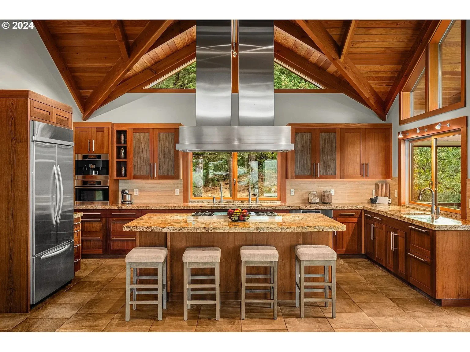 Rustic kitchen with wood cabinets and large island