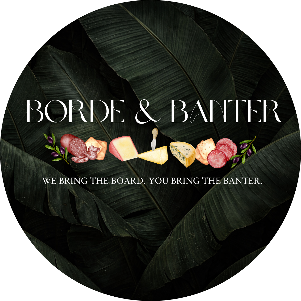 A black background with large green tropical leaves and a border of assorted cheeses, meats, and herbs in front. The text reads 'Borde & Baiser' with a subtitle 'We bring the board. You bring the banter.'
