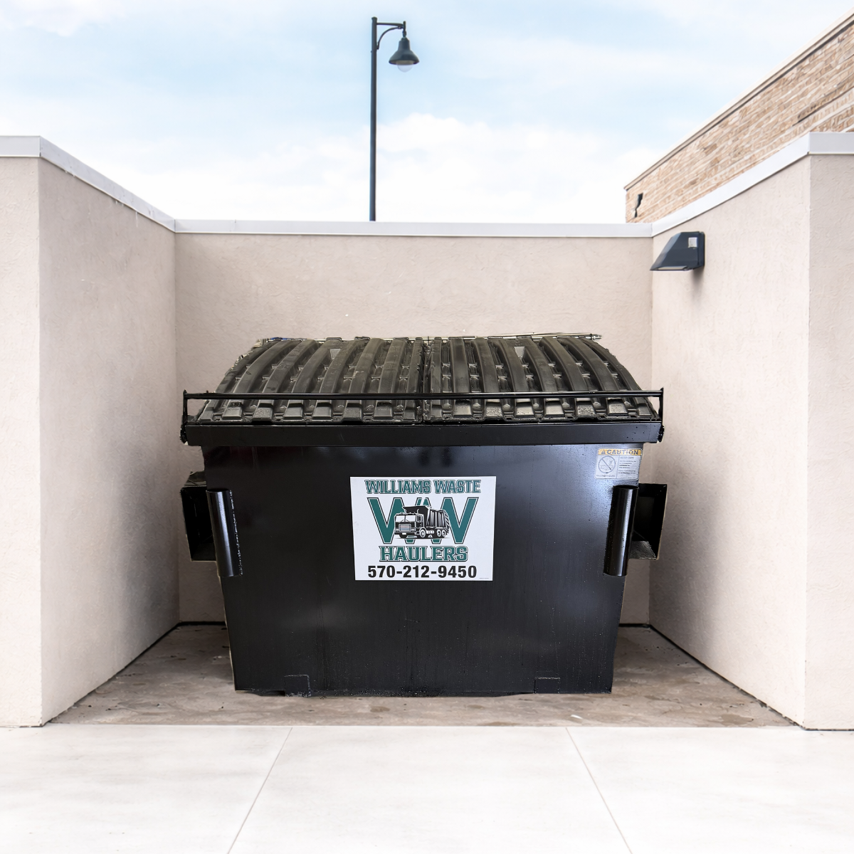 Front load dumpster service by Williams Waste Haulers for commercial trash pickup in Williamsport PA