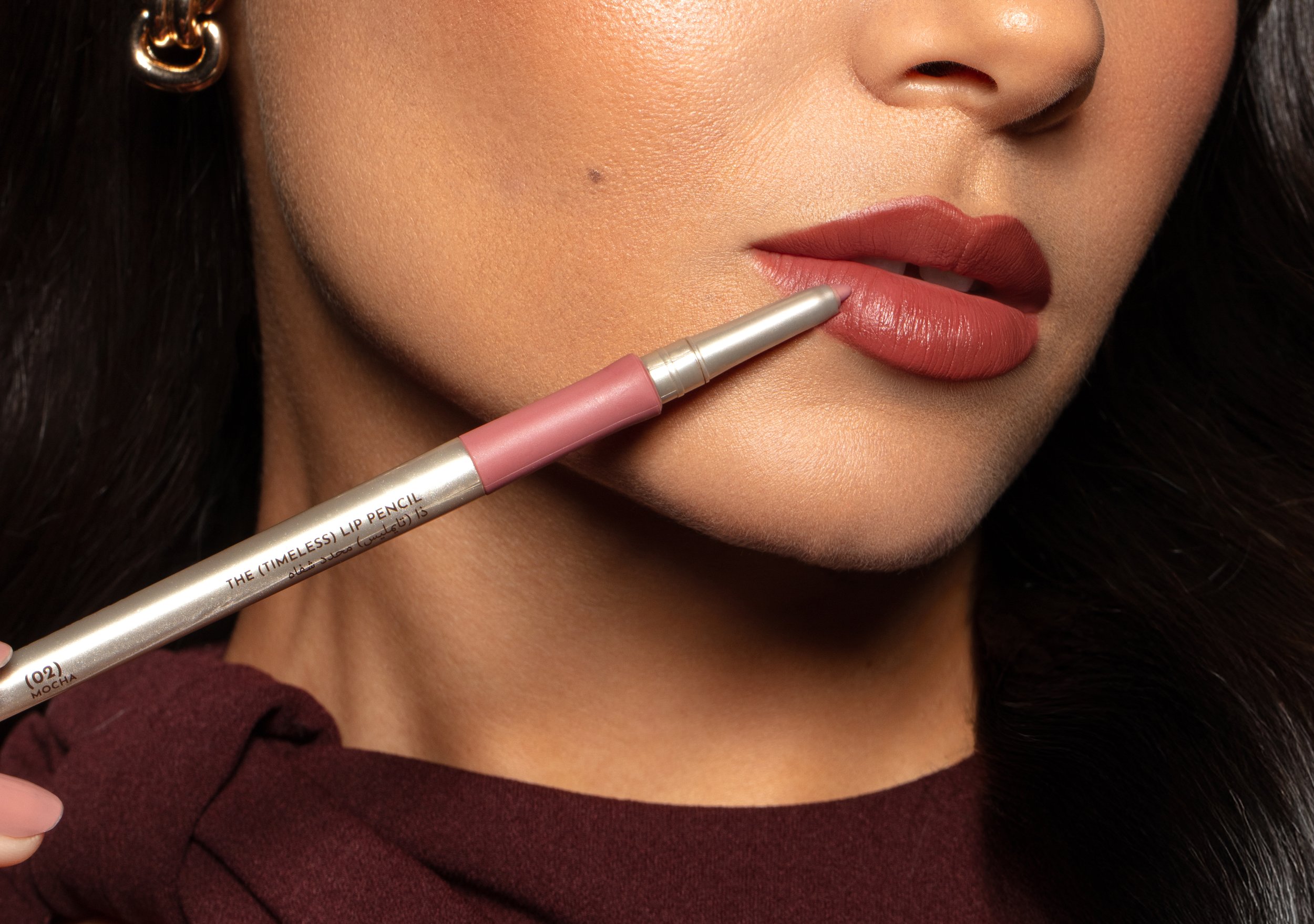 Close-up lip liner application for TRU(HUE), focusing on precision makeup use, product styling, and cosmetics packaging design cues.