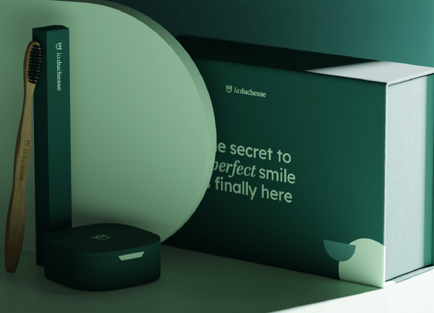 Dental care product packaging with toothbrush, box with La Duchesse branding, and a small container.