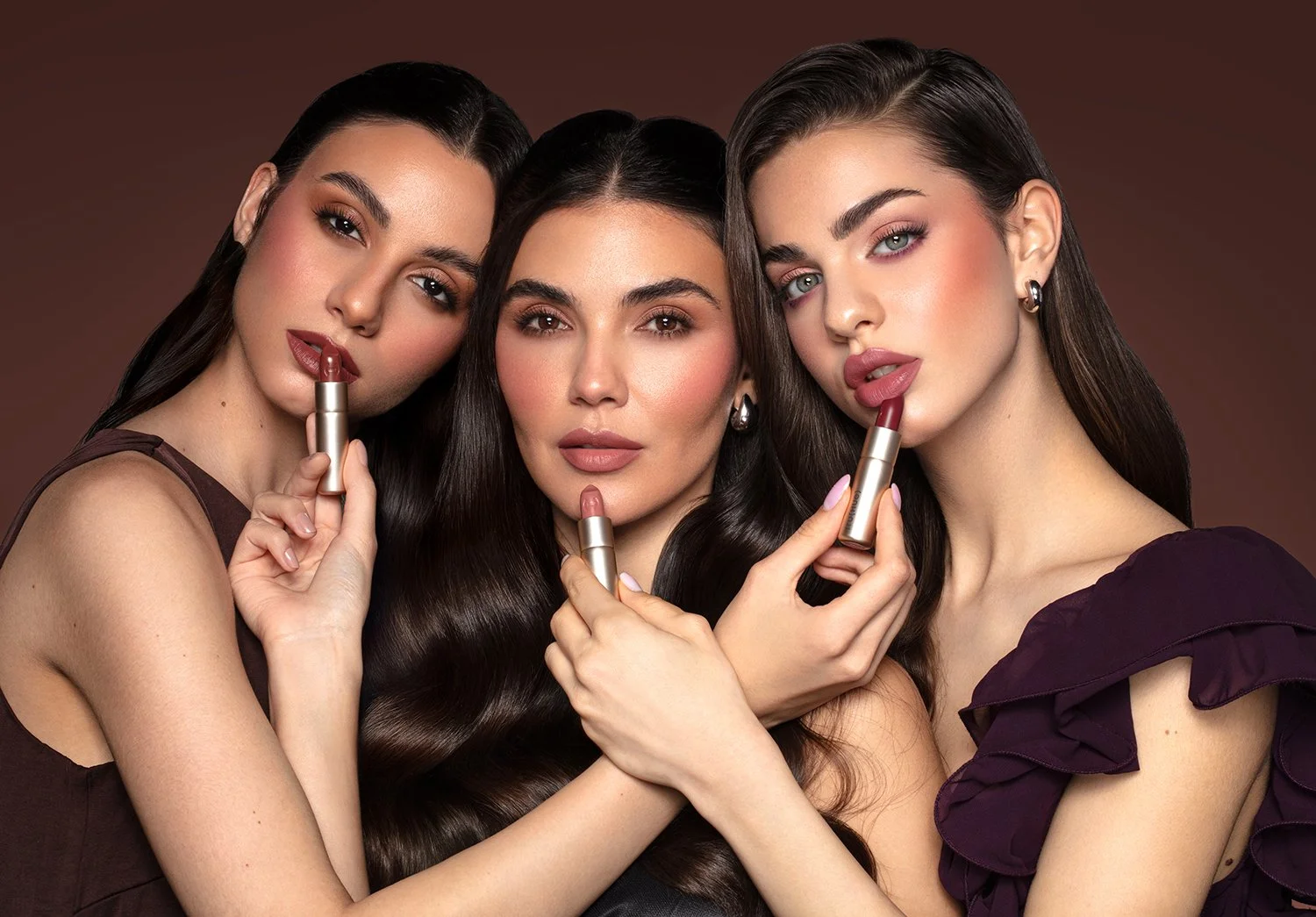 Three models with TRU(HUE) lipsticks representing inclusive beauty casting, cosmetics campaign photography, and product packaging design.