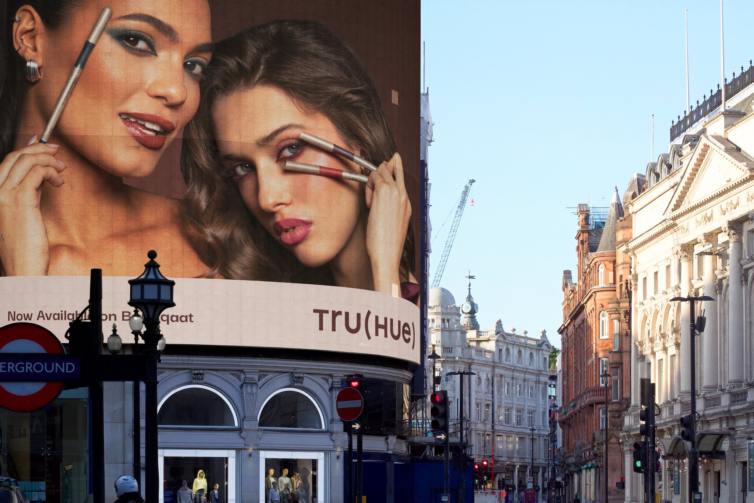 TRU(HUE) outdoor billboard showcasing cosmetics advertising design, beauty campaign art direction, and makeup brand messaging.