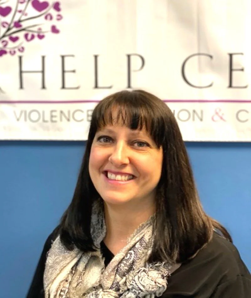 Headshot of Jennifer Dyer in front of the Self Help Center sign