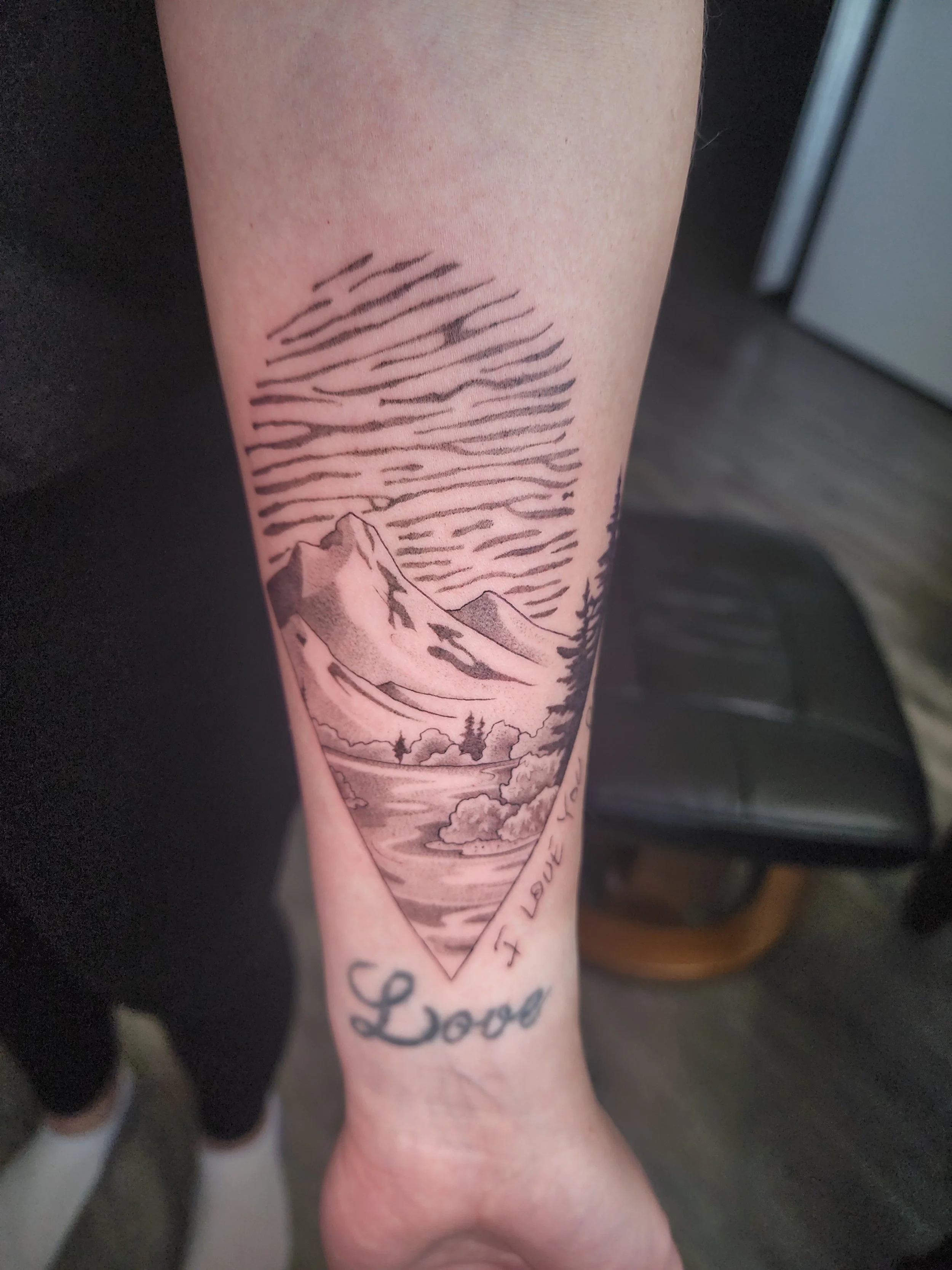 black and grey mountain tattoo with finger print