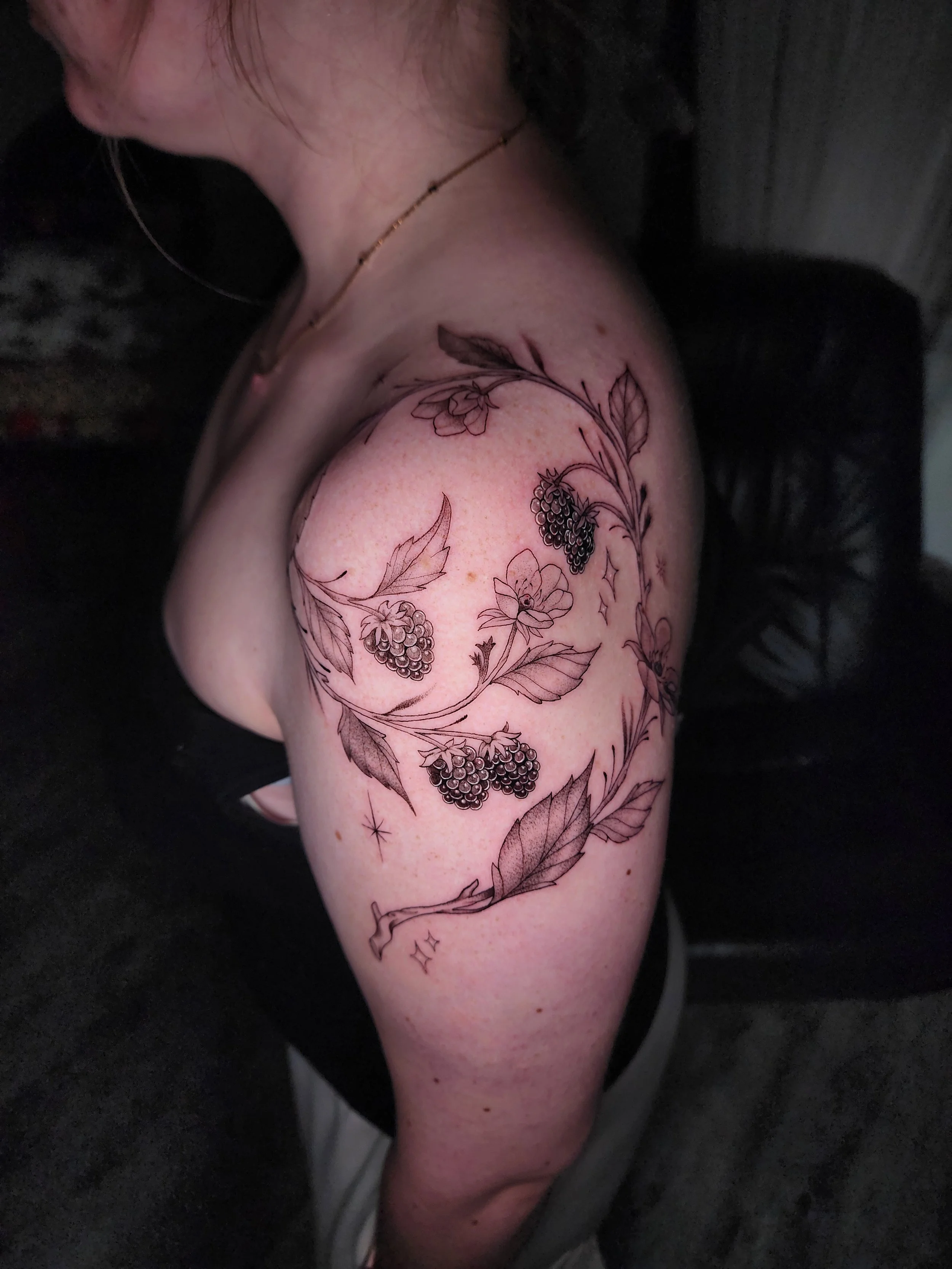 black and grey raspberry vine shoulder tattoo