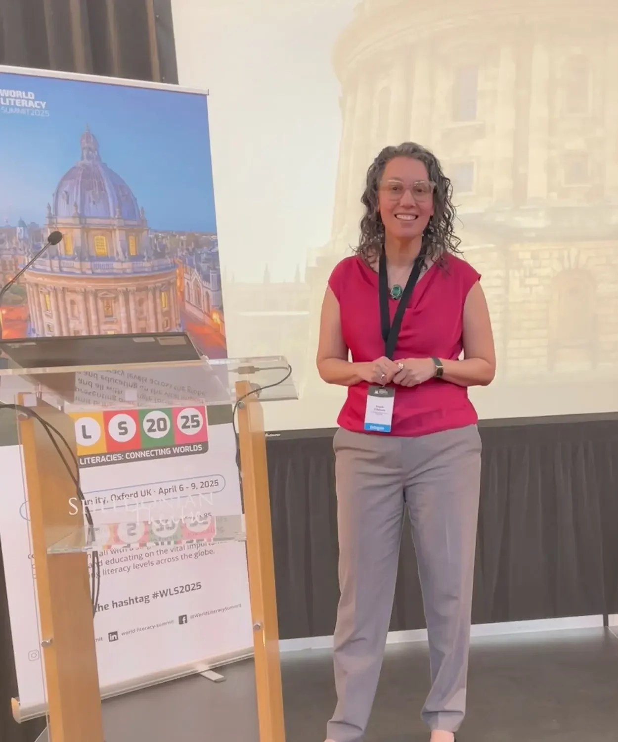 Angela Marie D'Antonio, on stage speaking at Oxford University.