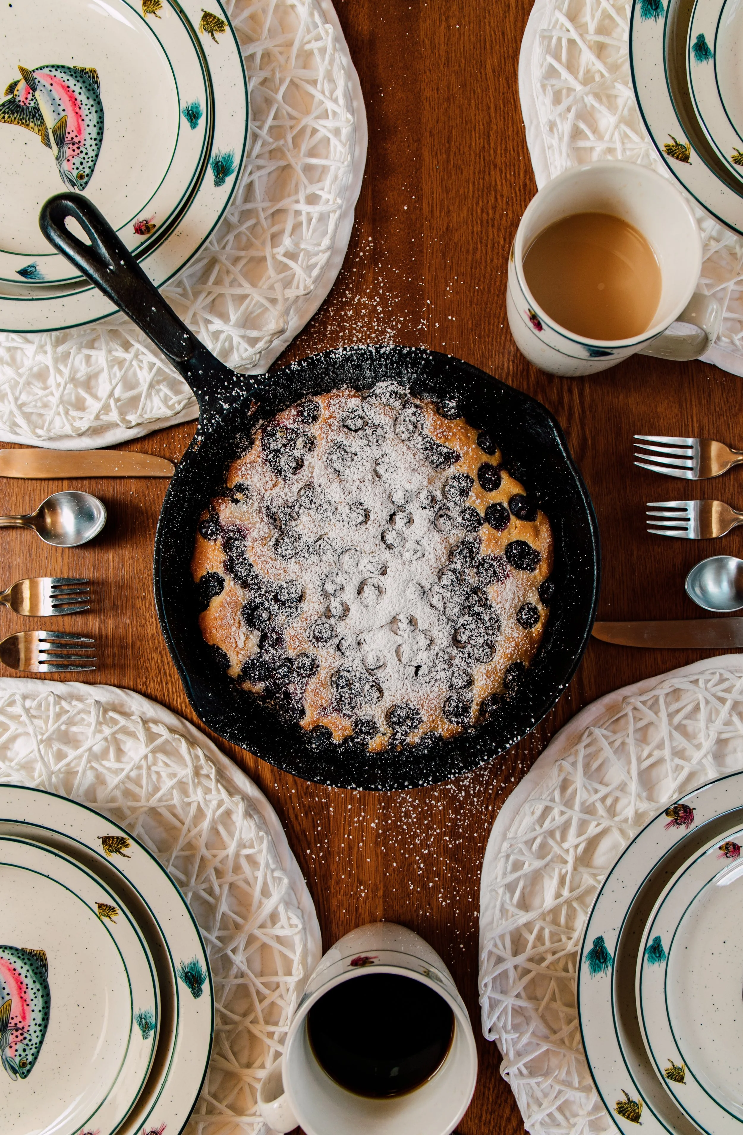 yummy breakfast pancake skillet with blueberries and dusted in powdered sugar seattle restaurant bakery photographer
