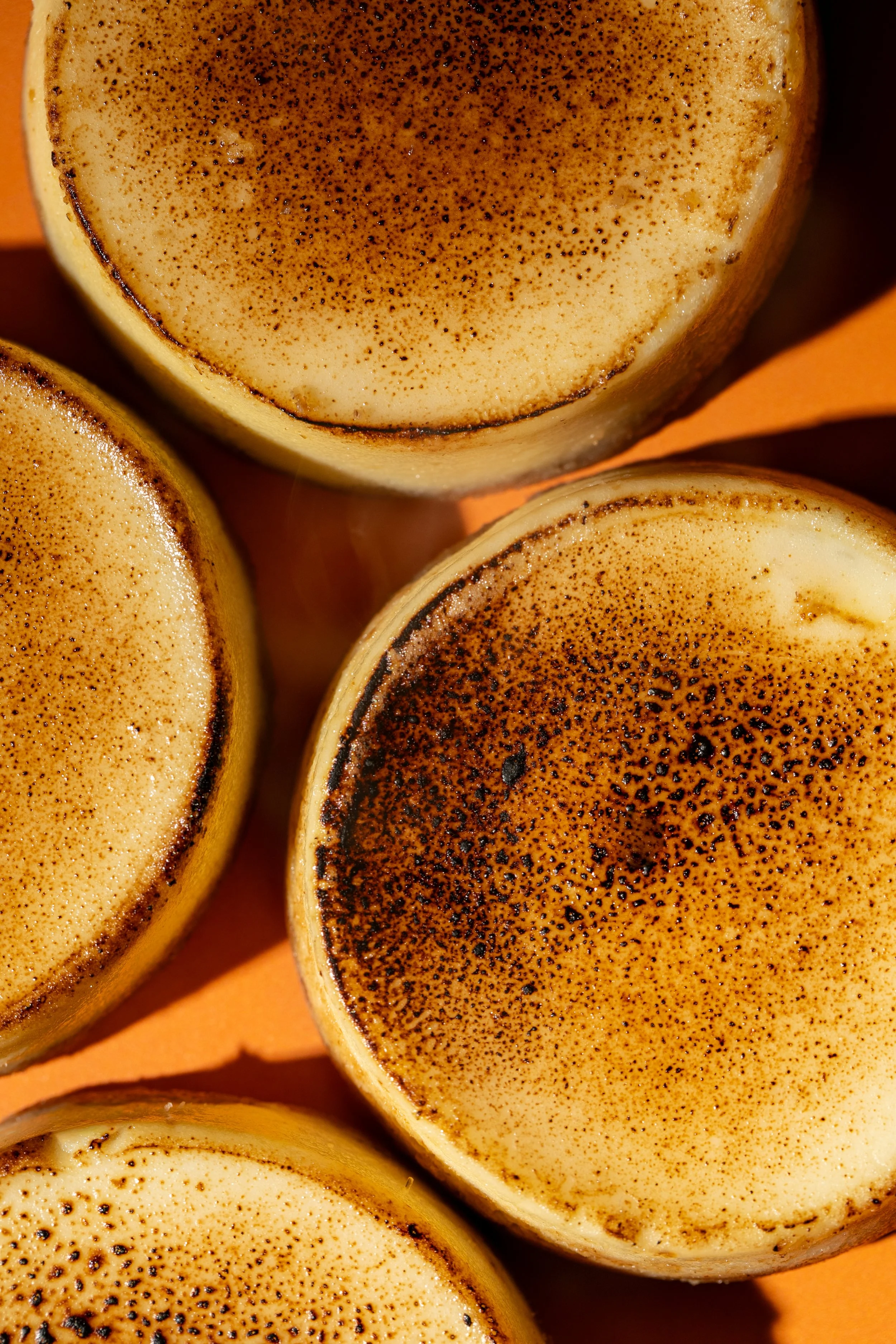 creme brulee cheesecake macro photography fall dessert flavor orange background treat photographer seattle chuckanut bay cheesecake