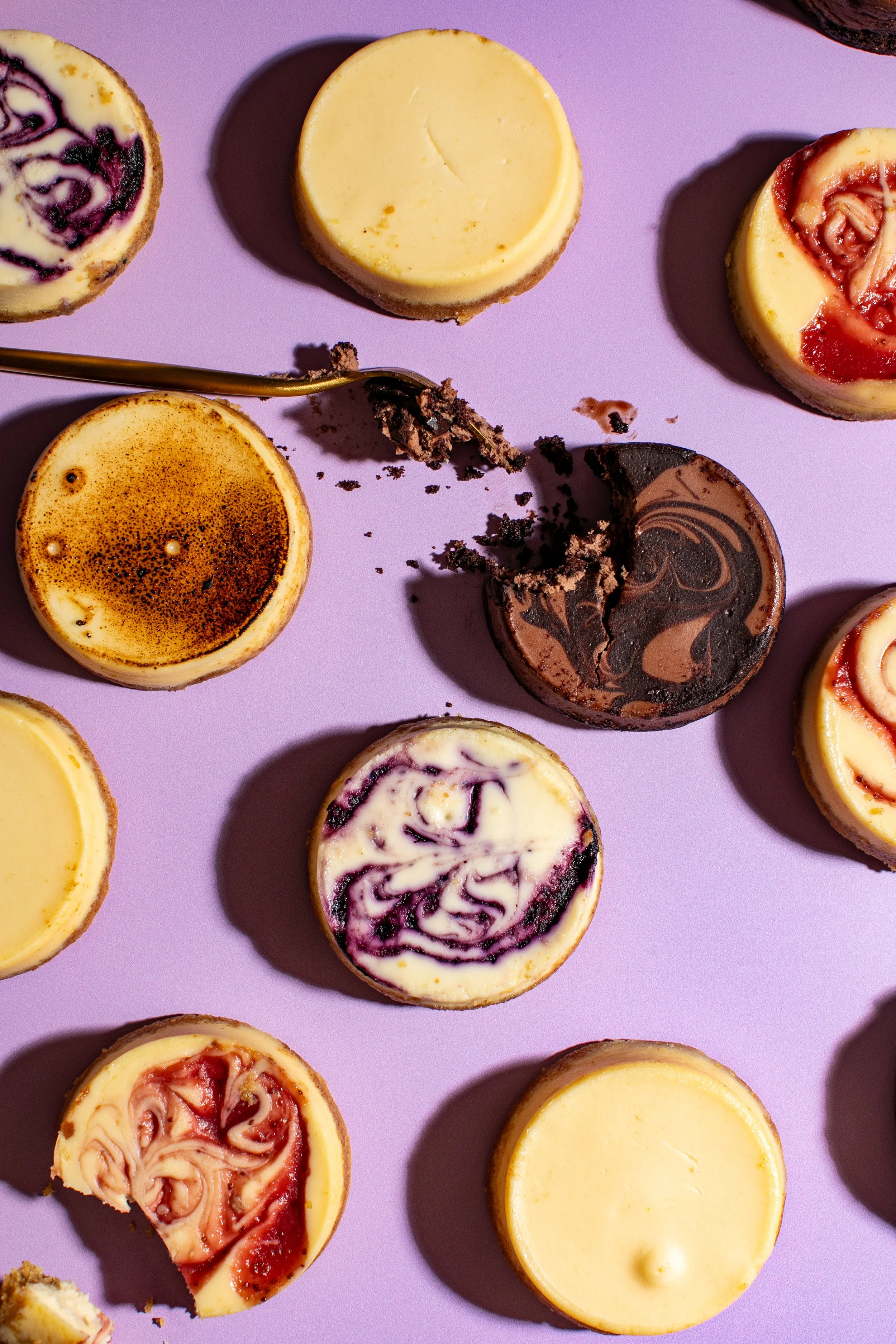 mini cheesecake top down shot purple background fun creative food photography for brands and packaged food companies seattle food photographer