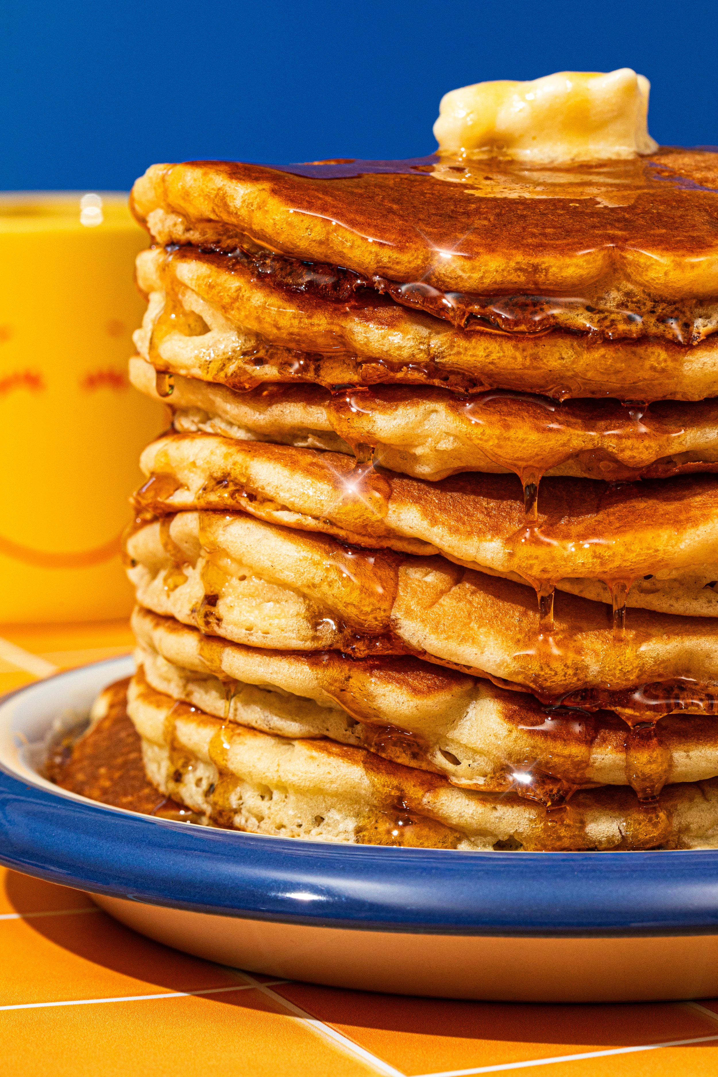 stack of pancakes dripping in syrup bright vintage diner style seattle food photographer