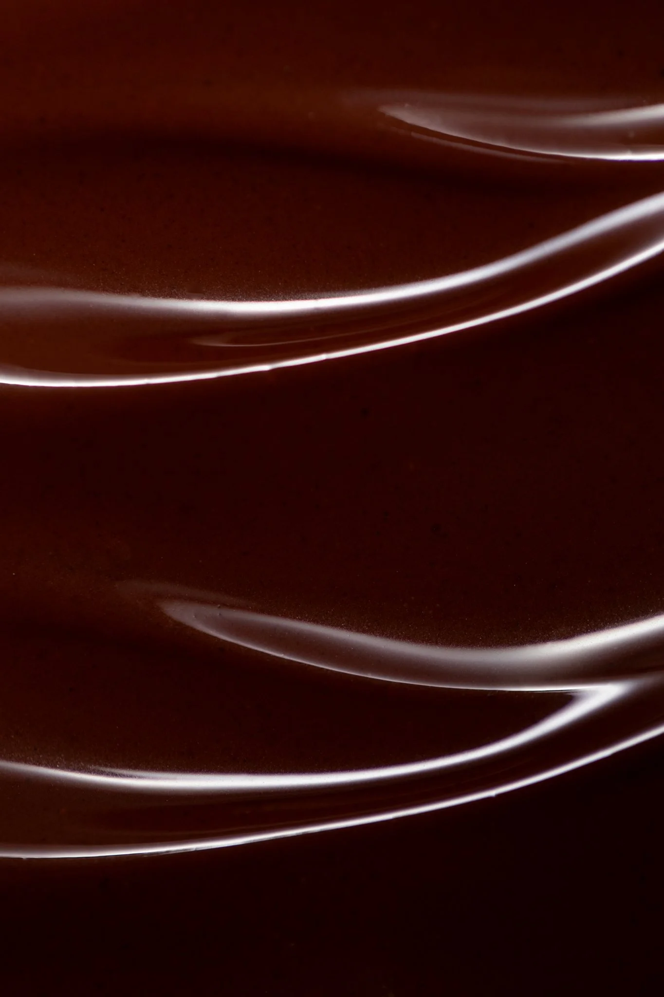 macro close up melted swirling dark chocolate photography