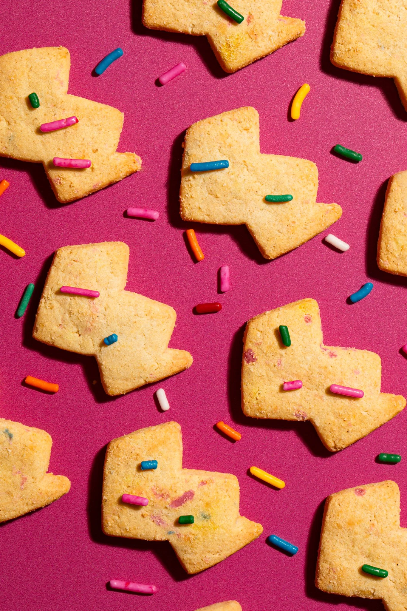 sugar cookie lightening bolt macro modern food photography happy birthday sprinkle cookie pattern pink background seattle packaged food brand photography