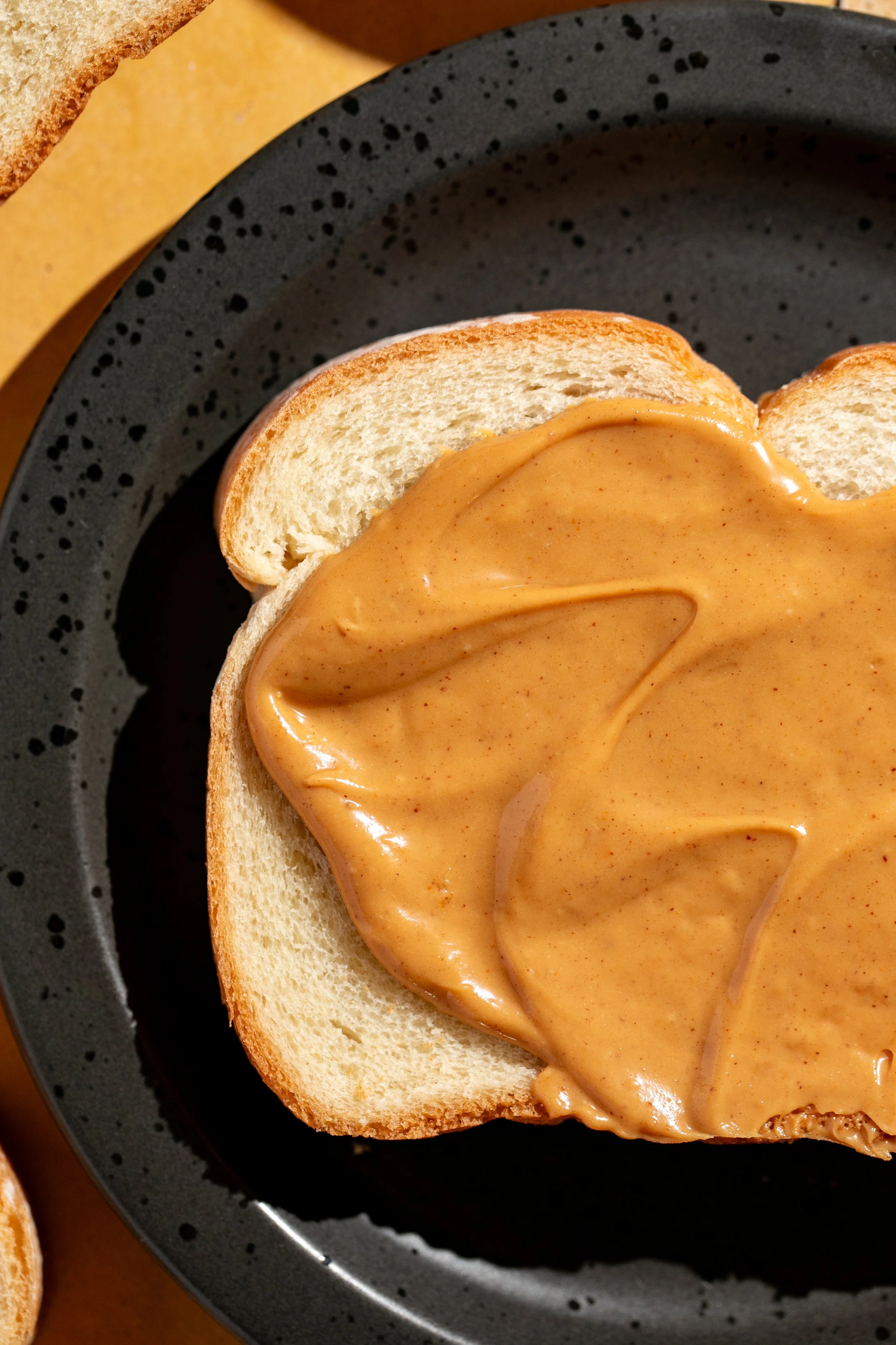 peanut butter swirled on fresh bread texture food imagery seattle food photographer