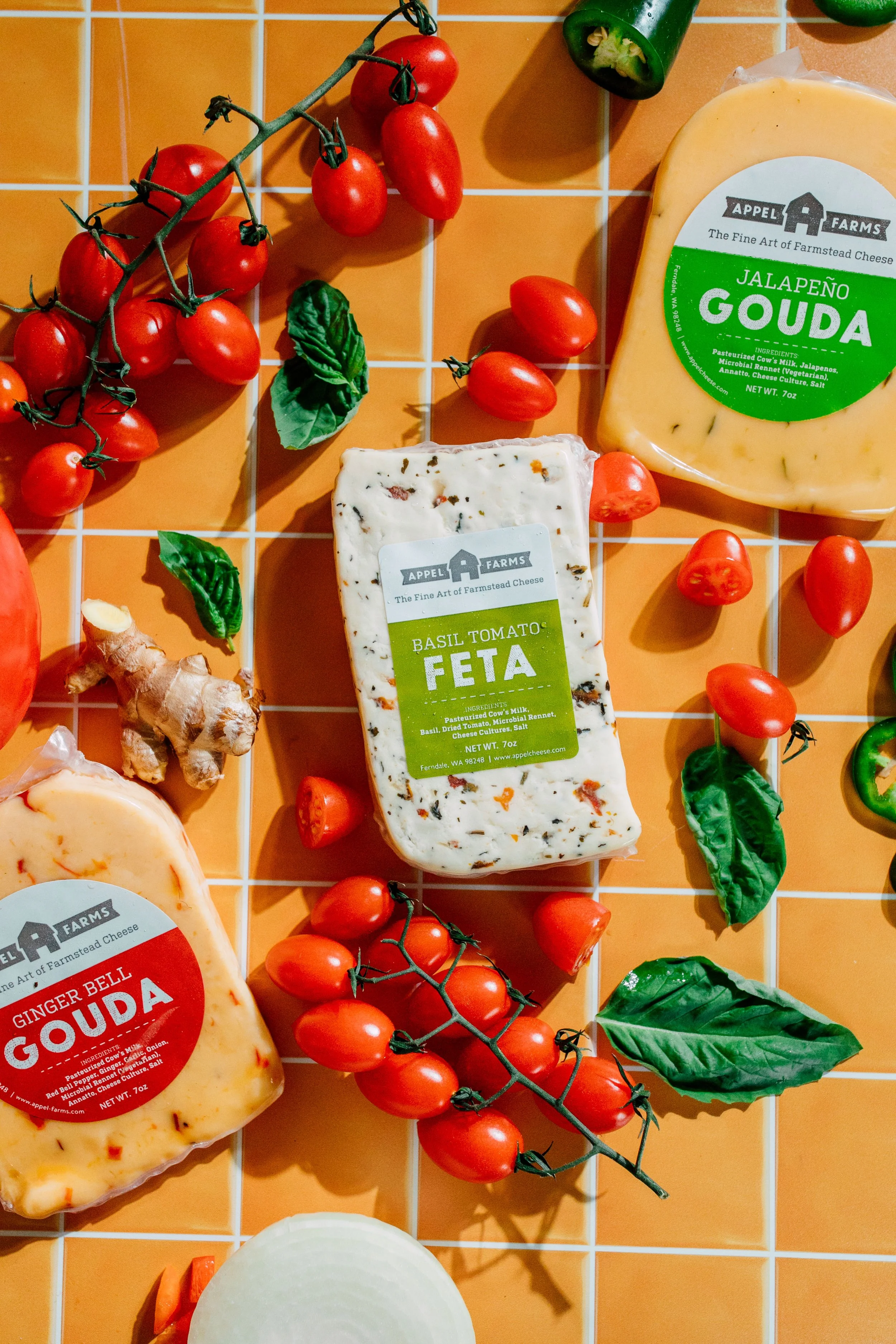 appel farms cheese product photography with fresh ingredients on yellow tile