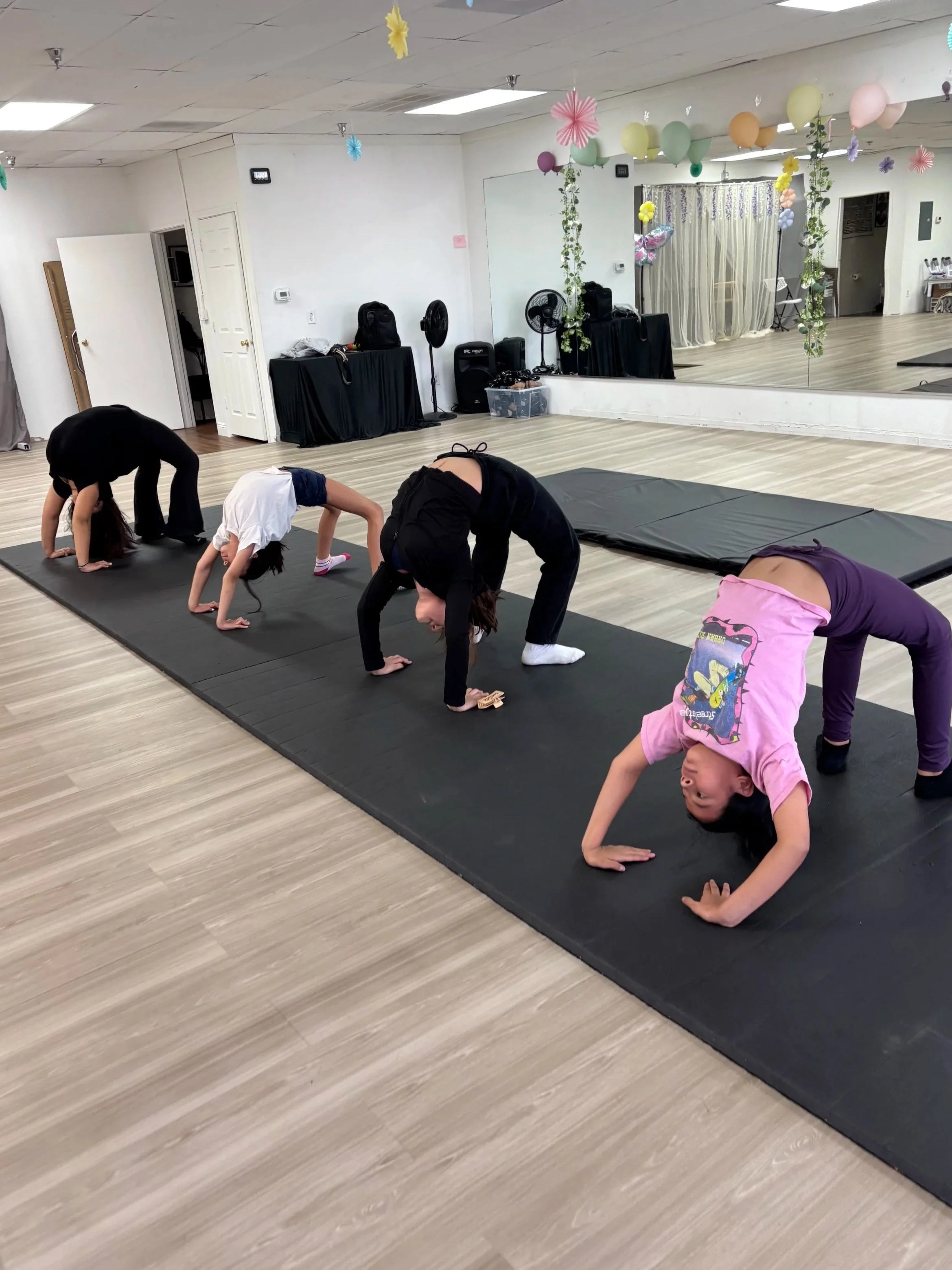 Kids doing backbends for warm up