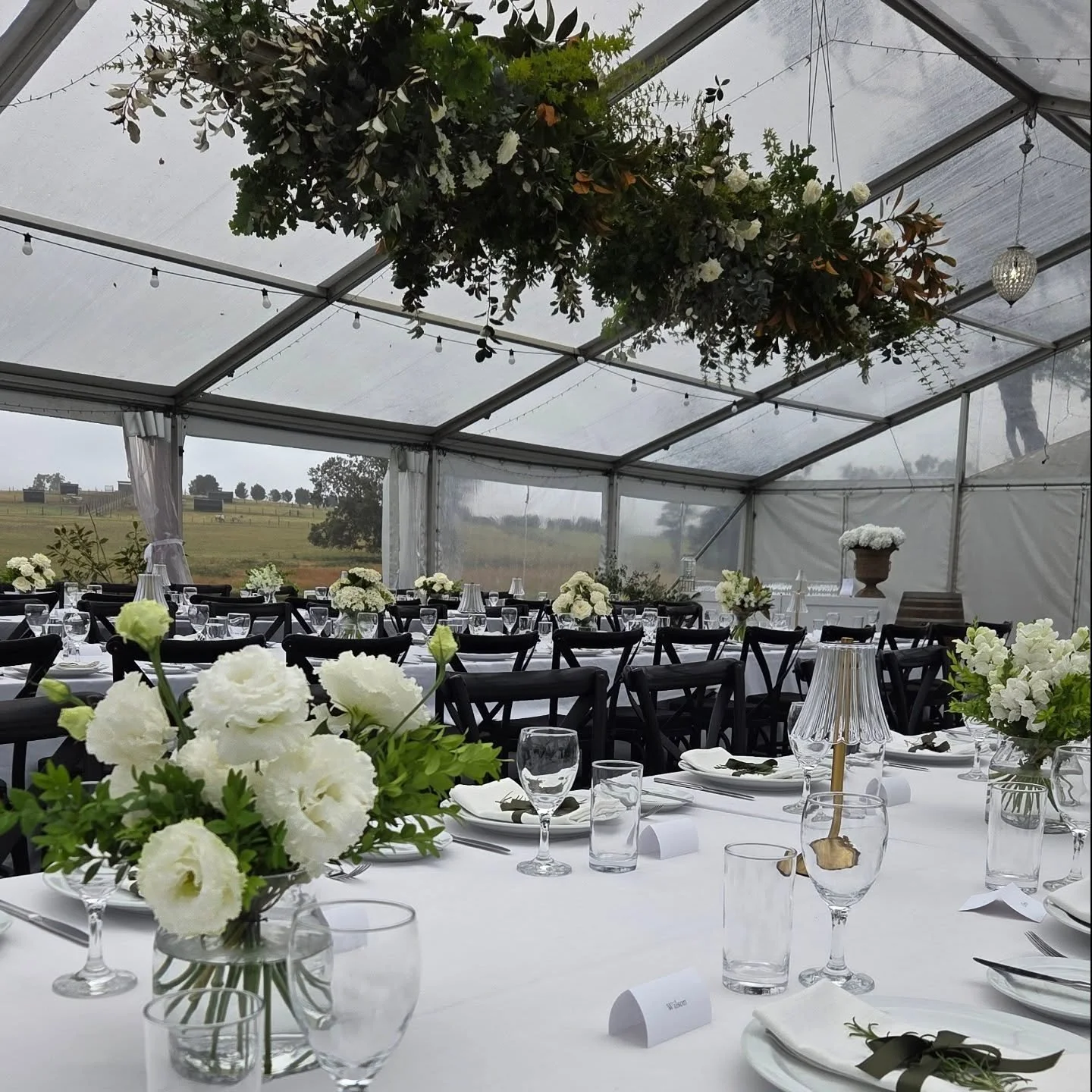Jess + Pat 🤍 22.11.25 🤍 
Classic elegance overlooking the dam on their family property.. 
.
.
.
#marqueewedding #weddingflowers #danikabellflorist #receptionflowers #whitewedding