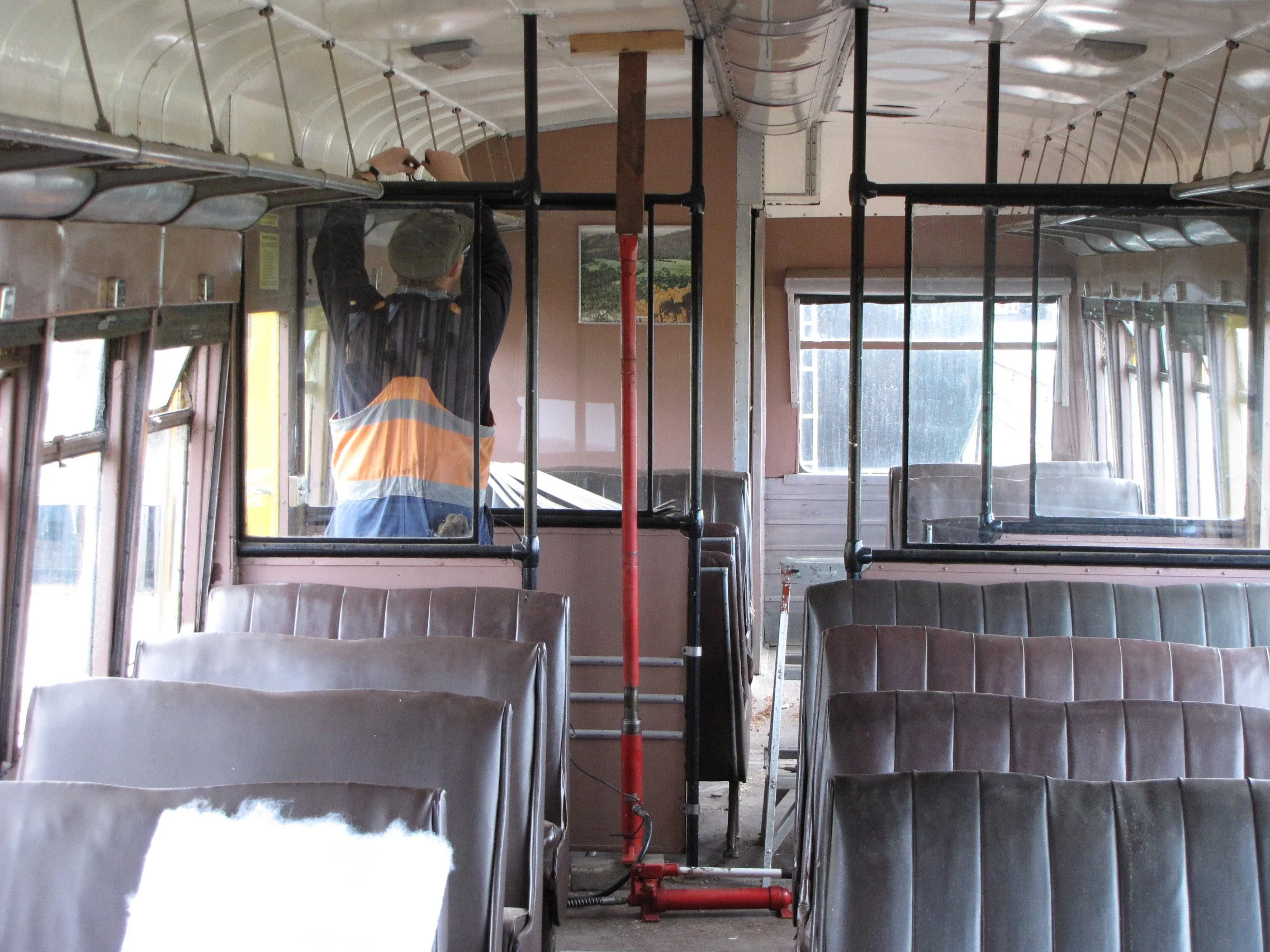 Installing new ceiling panels in 91s second class car with the help of the porta power.JPG