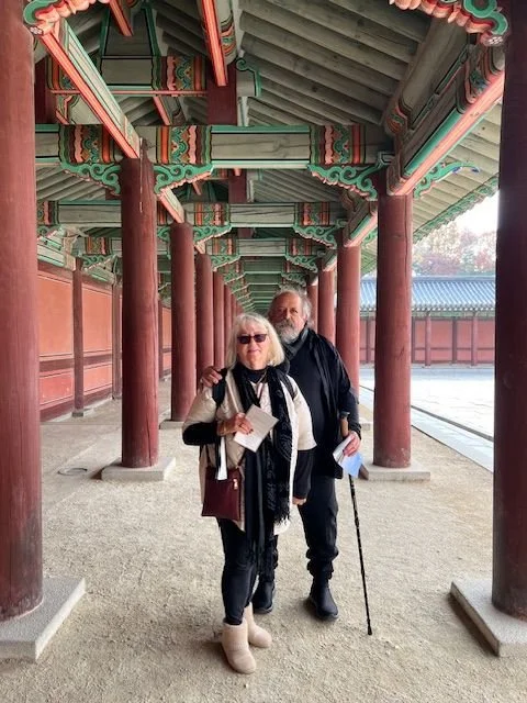man and woman posing in the palace walkway