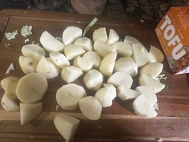 cut upp potatoes on a board