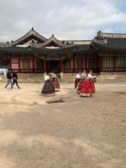 women walking in traditional Korean garments