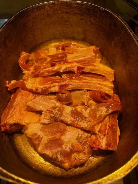pork pieces in a pot