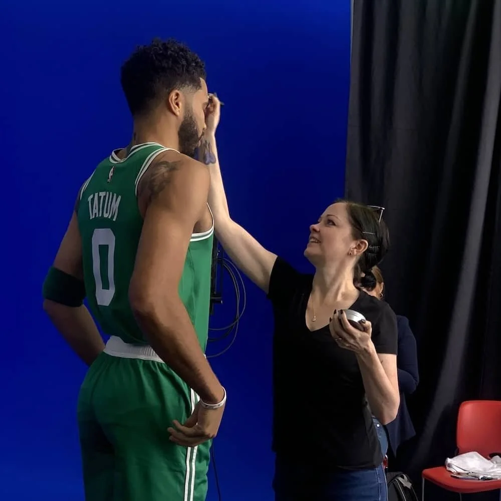 Boston Makeup Artist, Amber Lynne, applying makeup on set