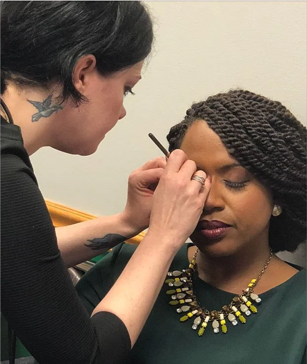 Boston Makeup Artist applying makeup to a political celebrity