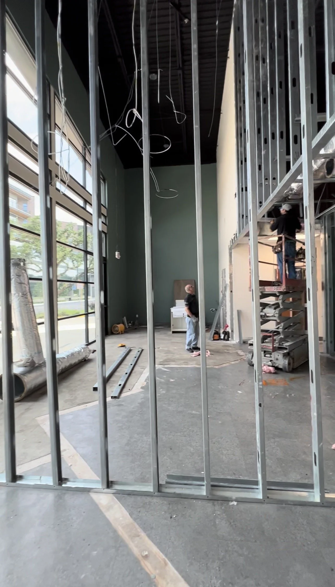 Light-gauge metal stud framing for a commercial interior, shown in progress.
