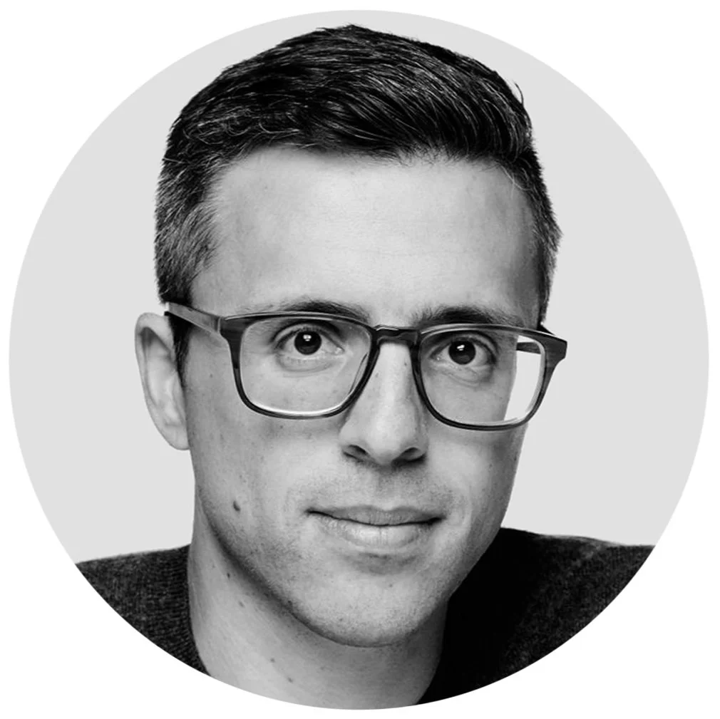 Black and white portrait of Ezra Klein.