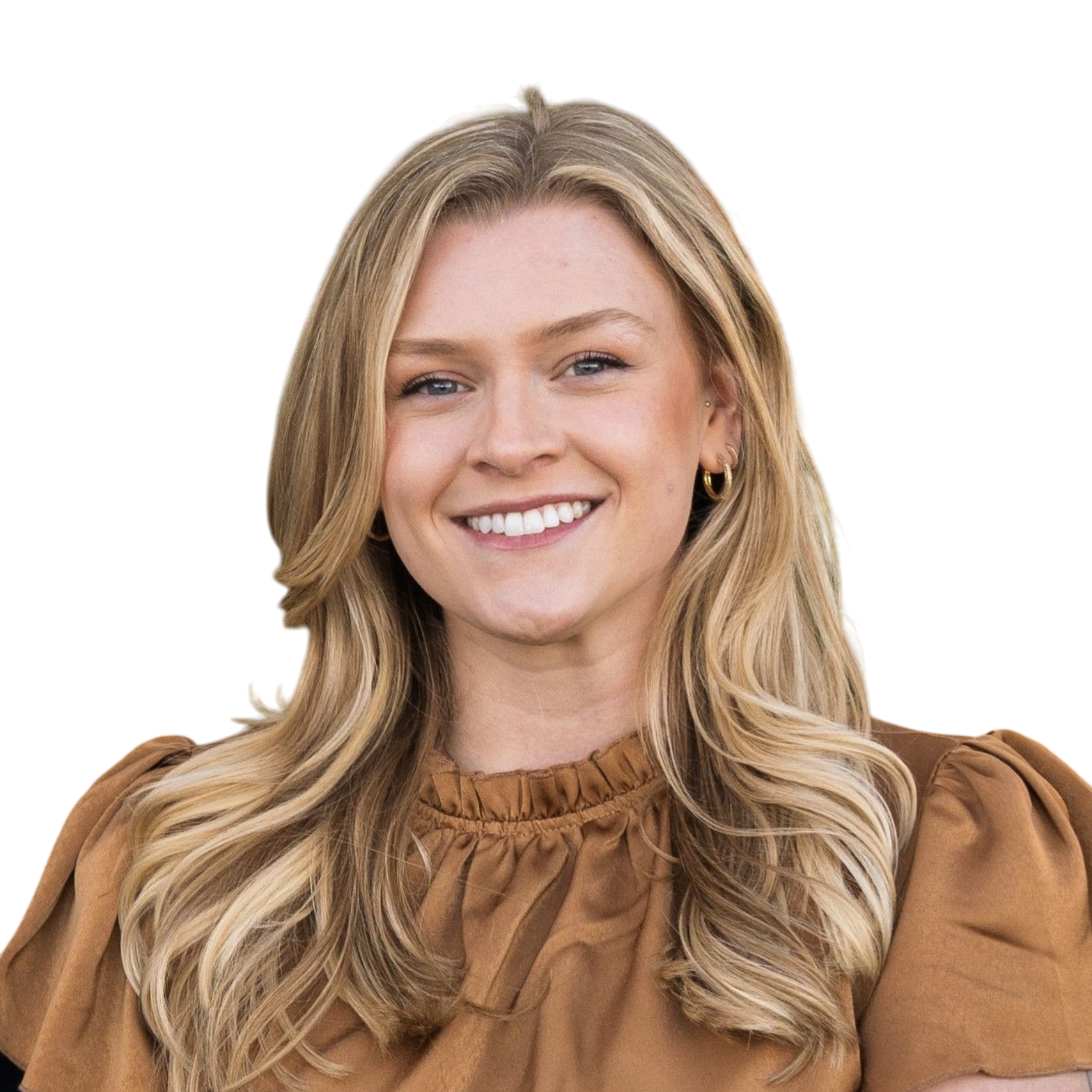 A smiling woman with long wavy blonde hair, wearing a brown blouse and small hoop earrings.