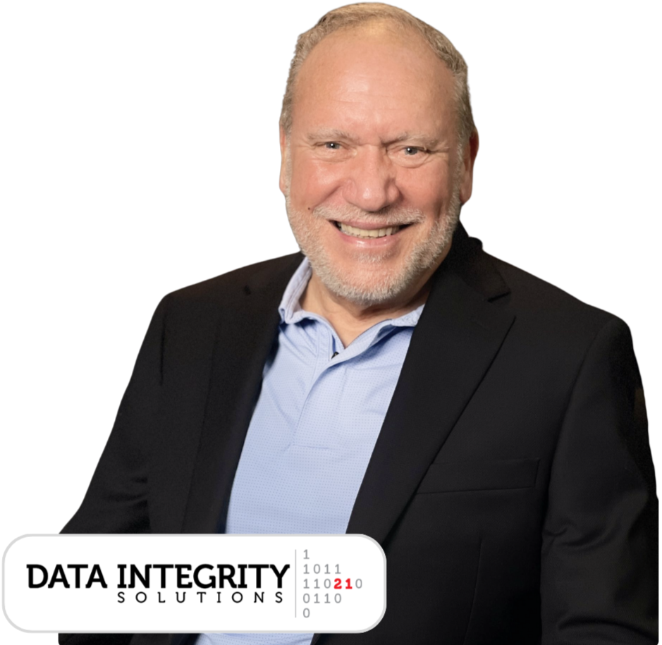 A smiling middle-aged man with a beard, wearing a black blazer and light blue dress shirt, in front of a black background with a logo reading 'Data Integrity Solutions' and binary code.