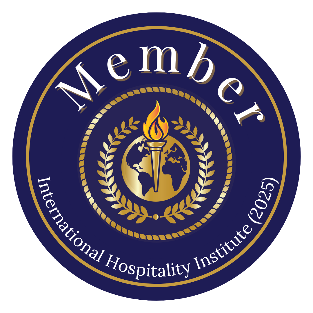 A circular emblem with a dark blue background and gold accents. It features a globe with continents, a torch with a flame in the center, and laurel branches encircling the torch. The text around the circle reads 'Member' at the top and 'International Hospitality Institute (IHI)' at the bottom.