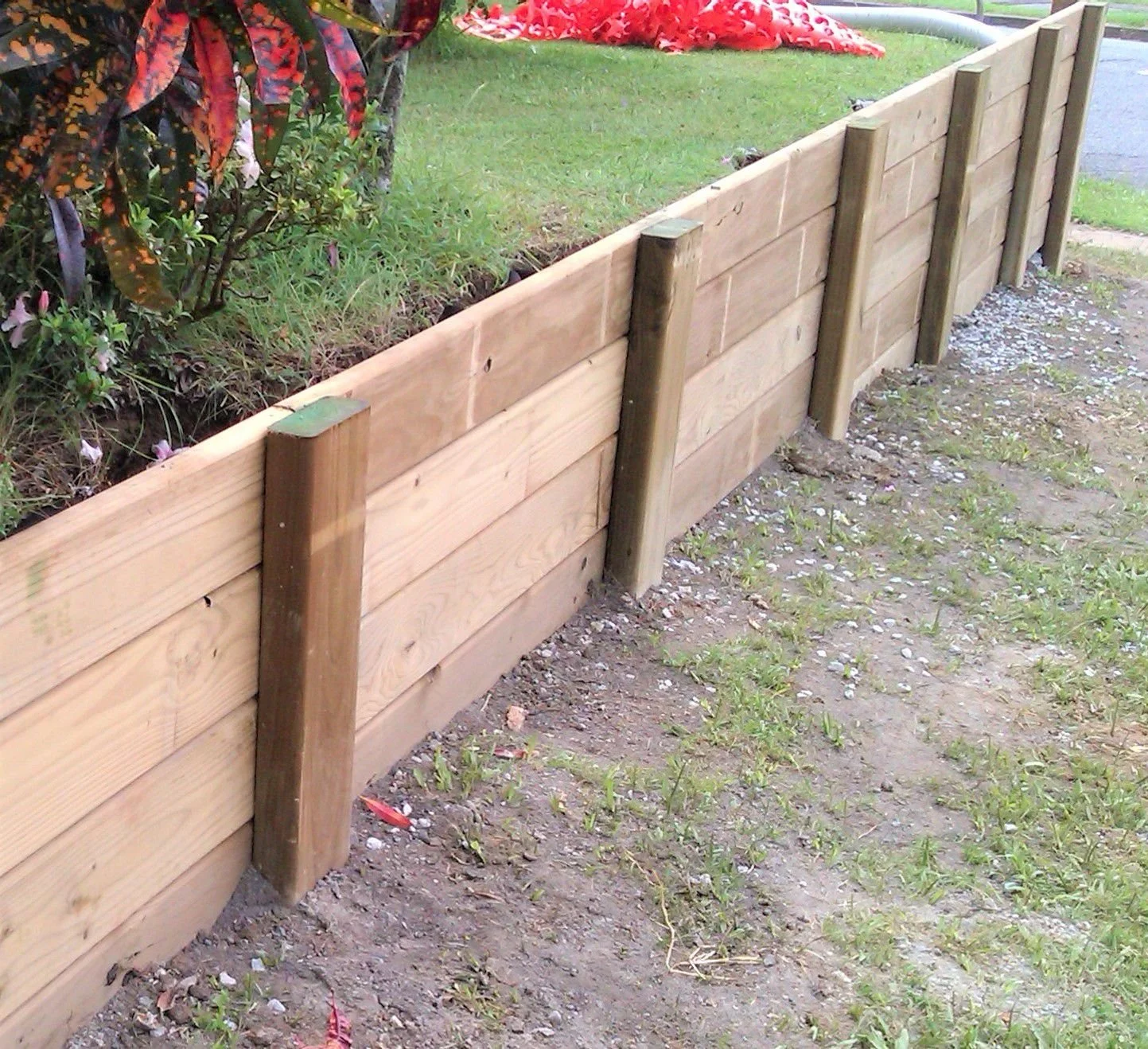 WoodRetainingWall-5bc6a63f46e0fb0026064c10.jpg