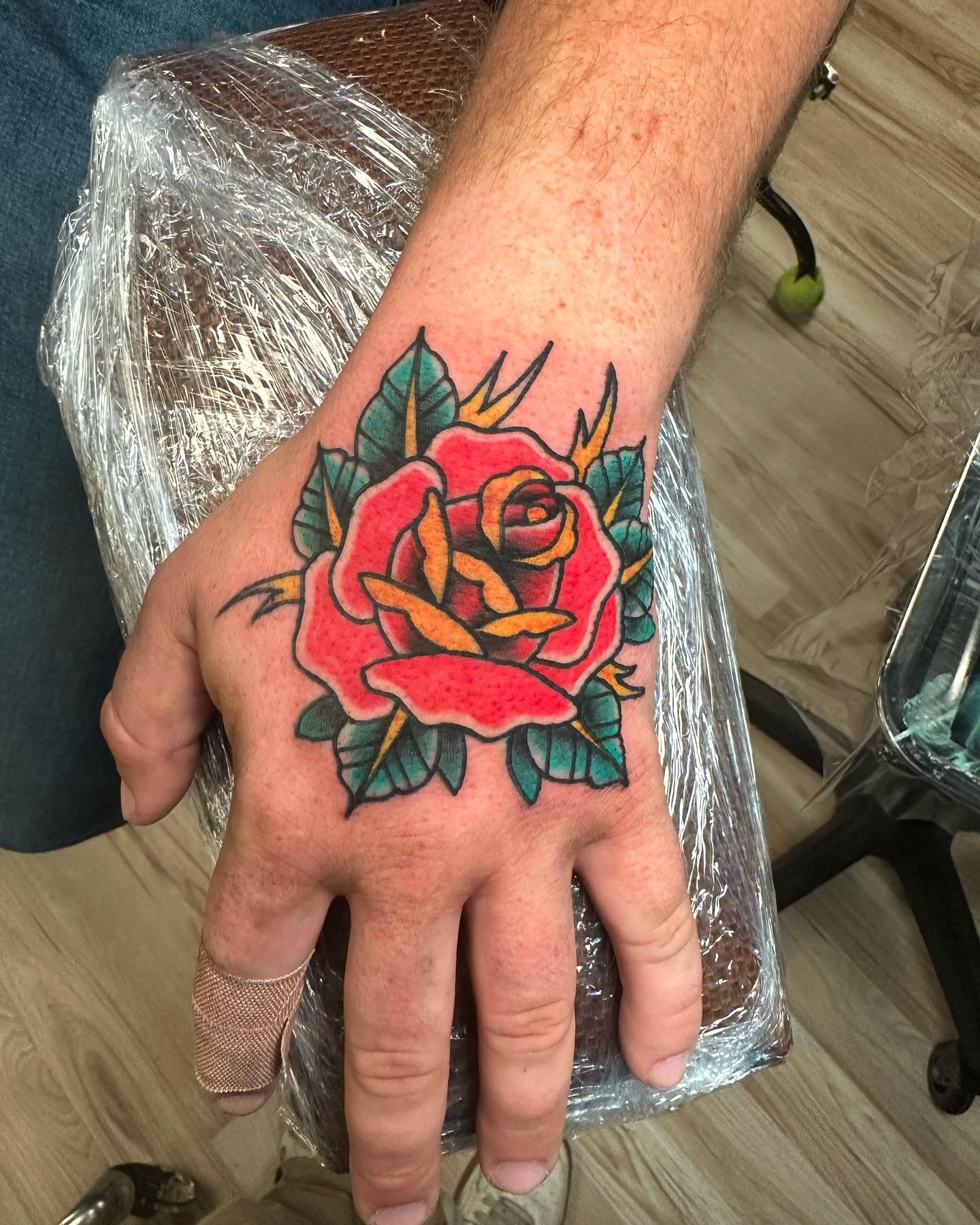 Did this job stopper the other day. Roses on your hand will always make you look 100x cooler. Done exclusively with @familytraditionsupply and @steadfasttattoosupply products. I only have a couple days left to book in November so get in where you fit