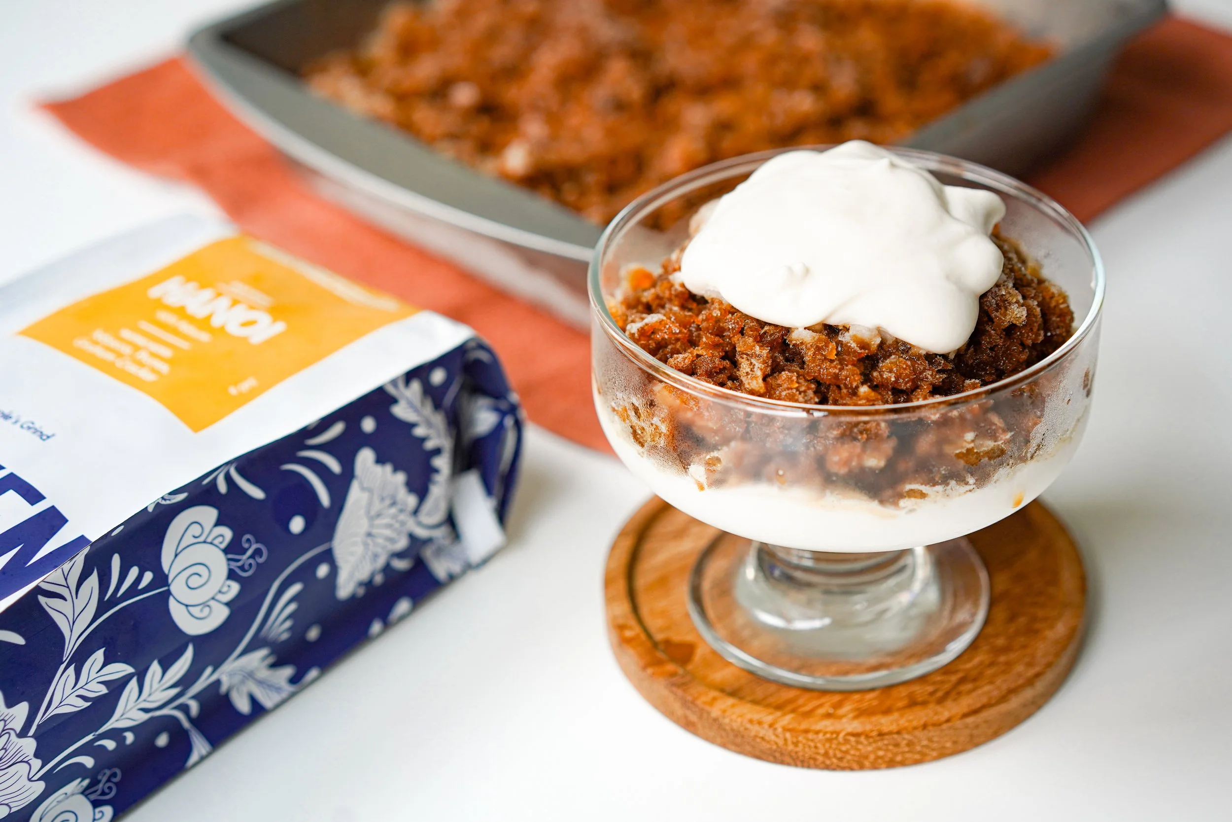 Coffee dessert with whipped cream and coffee packaging.
