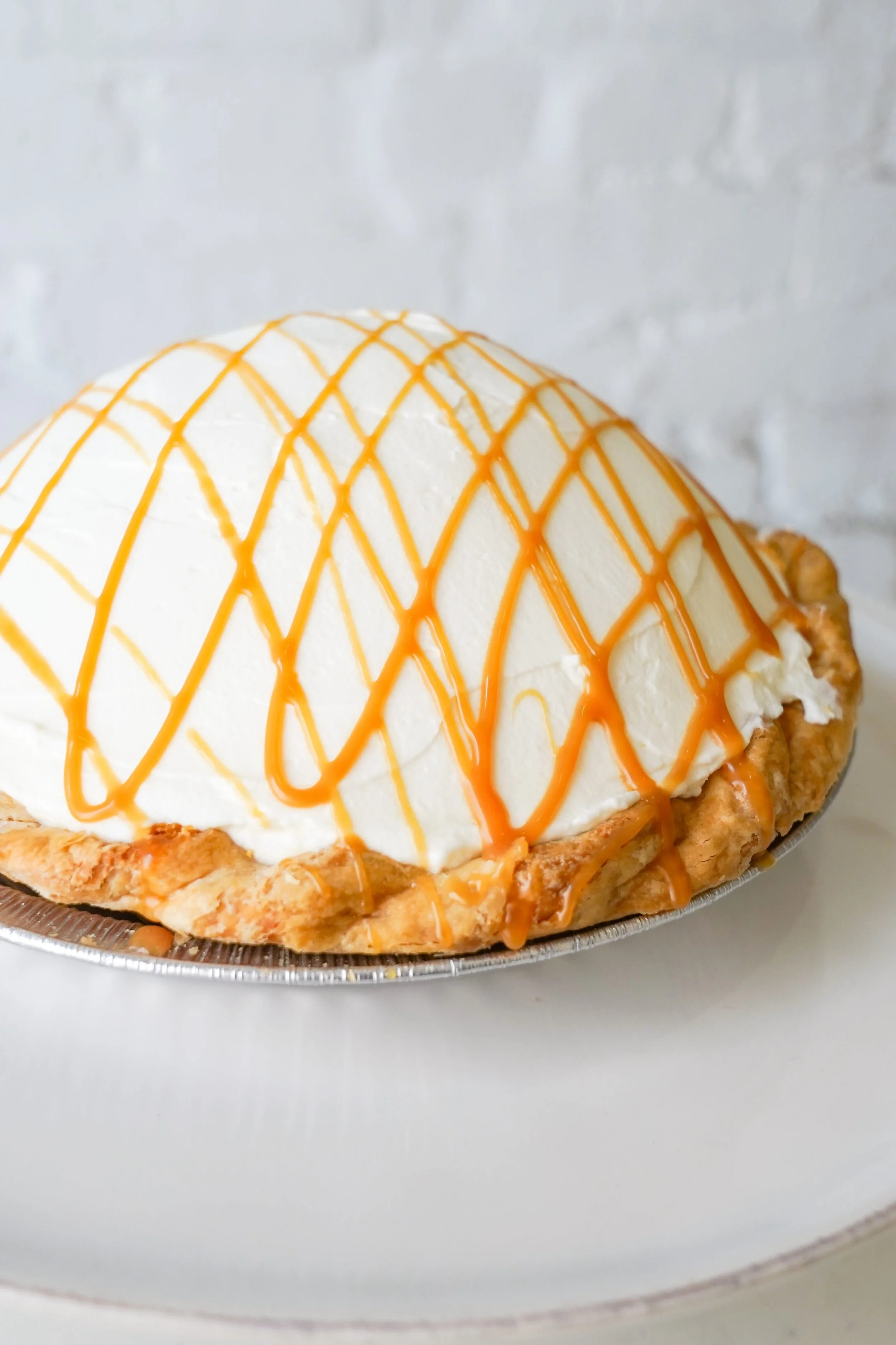 Cream pie with caramel drizzles on top