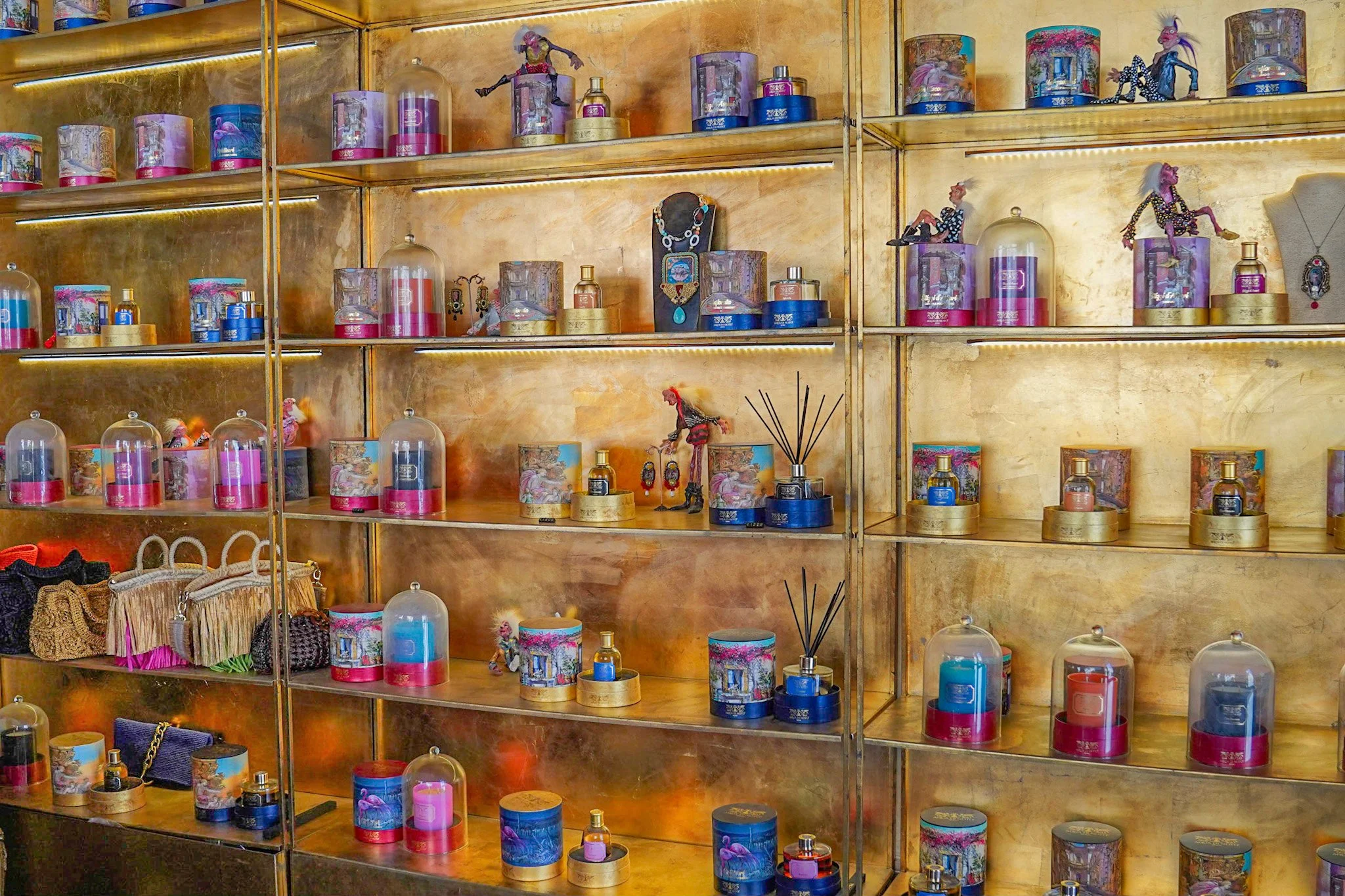 Shelves displaying luxury perfumes and decorative items