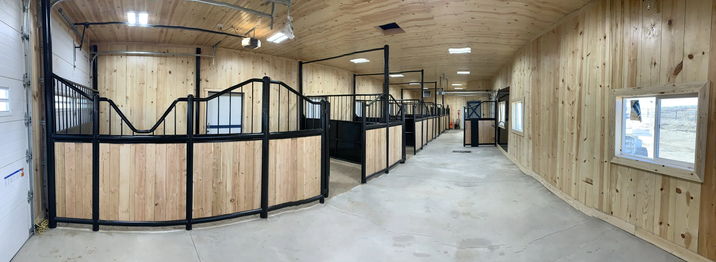 Stable with custom stalls and iron work
