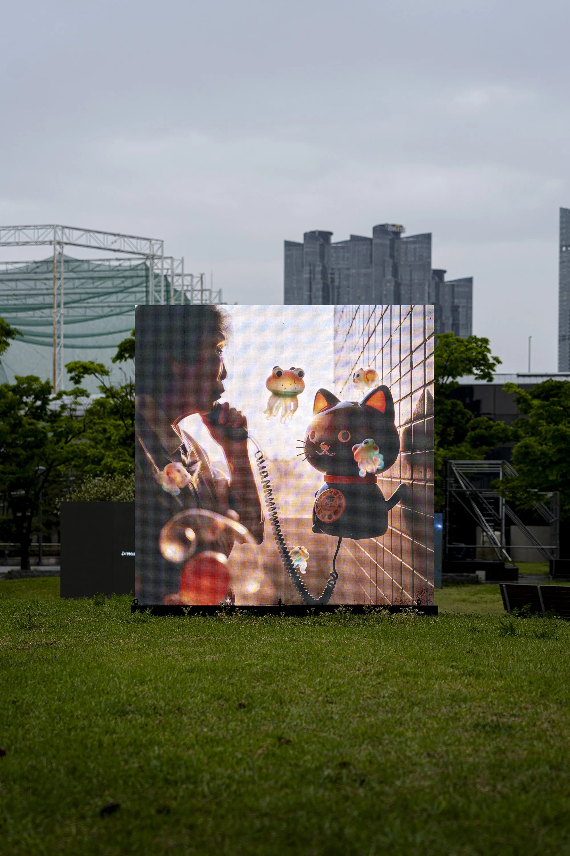 "19:19" by niceaunties on a 2x2m outdoor LED screen, Busan Museum of Art Sculpture Garden. Digital Subculture: Narrative & Story in the Digital Era, 23 April to 28 June 2026